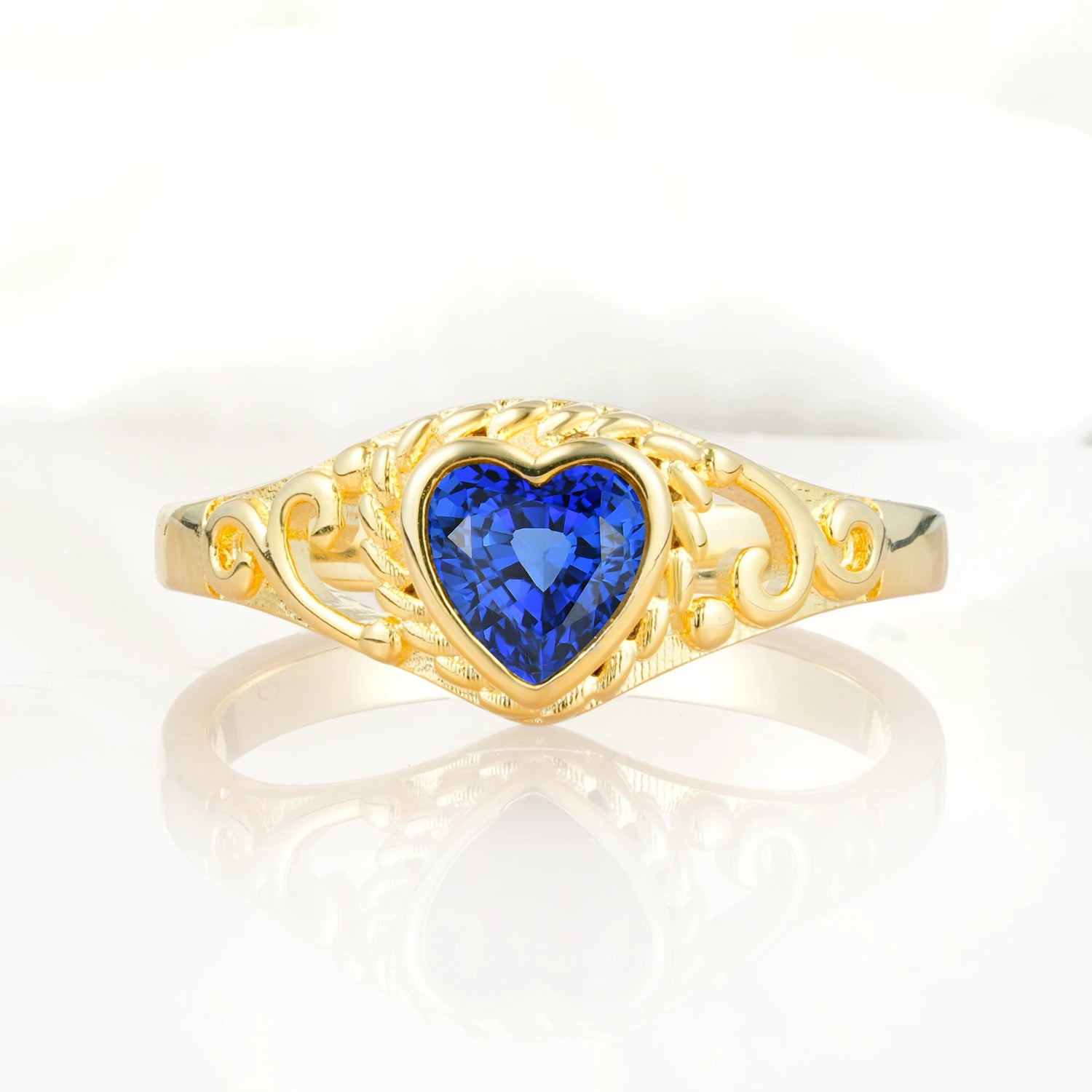 Heart-Shaped Sapphire Engagement Ring with Intricate Band