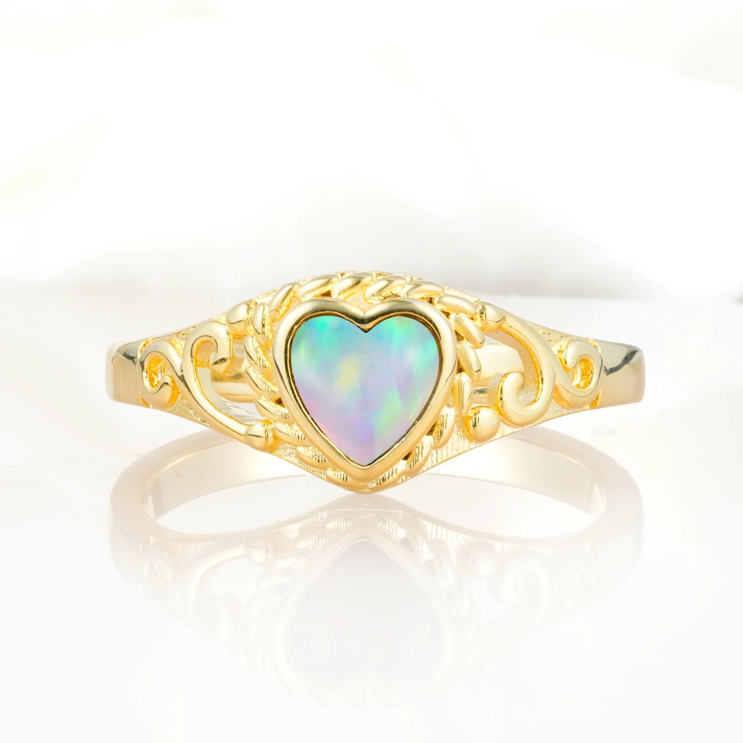 Heart-Shaped Opal Engagement Ring with Intricate Band
