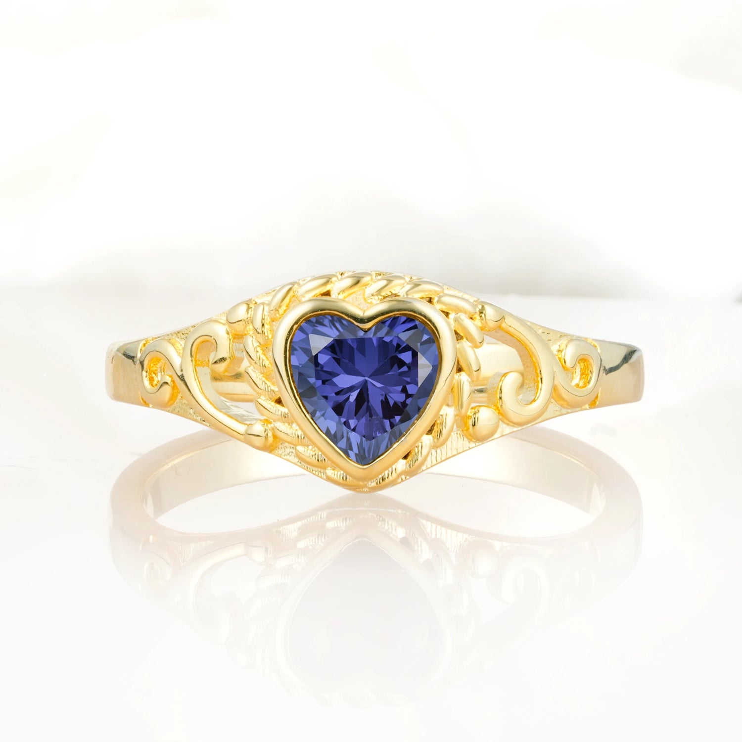Heart-Shaped Tanzanite Engagement Ring with Intricate Band