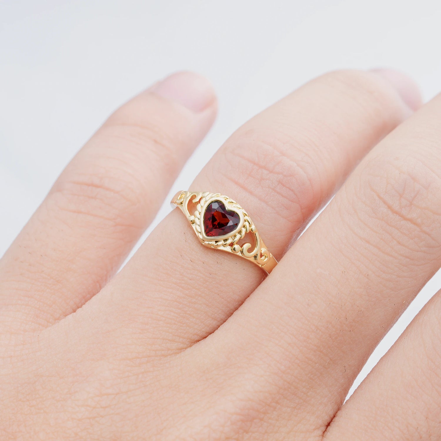 Heart-Shaped Garnet Engagement Ring with Intricate Band