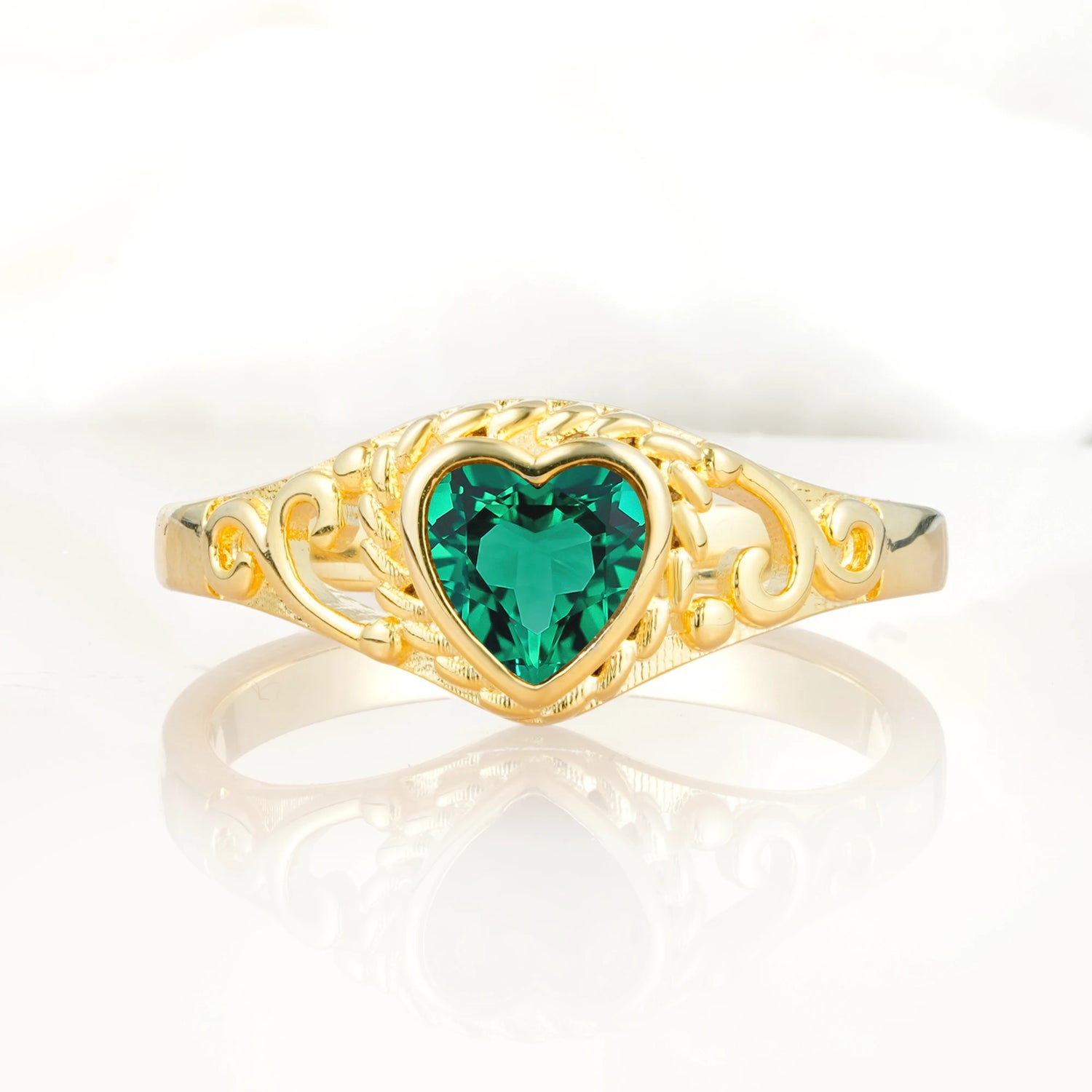 Heart-Shaped Emerald Engagement Ring with Intricate Band