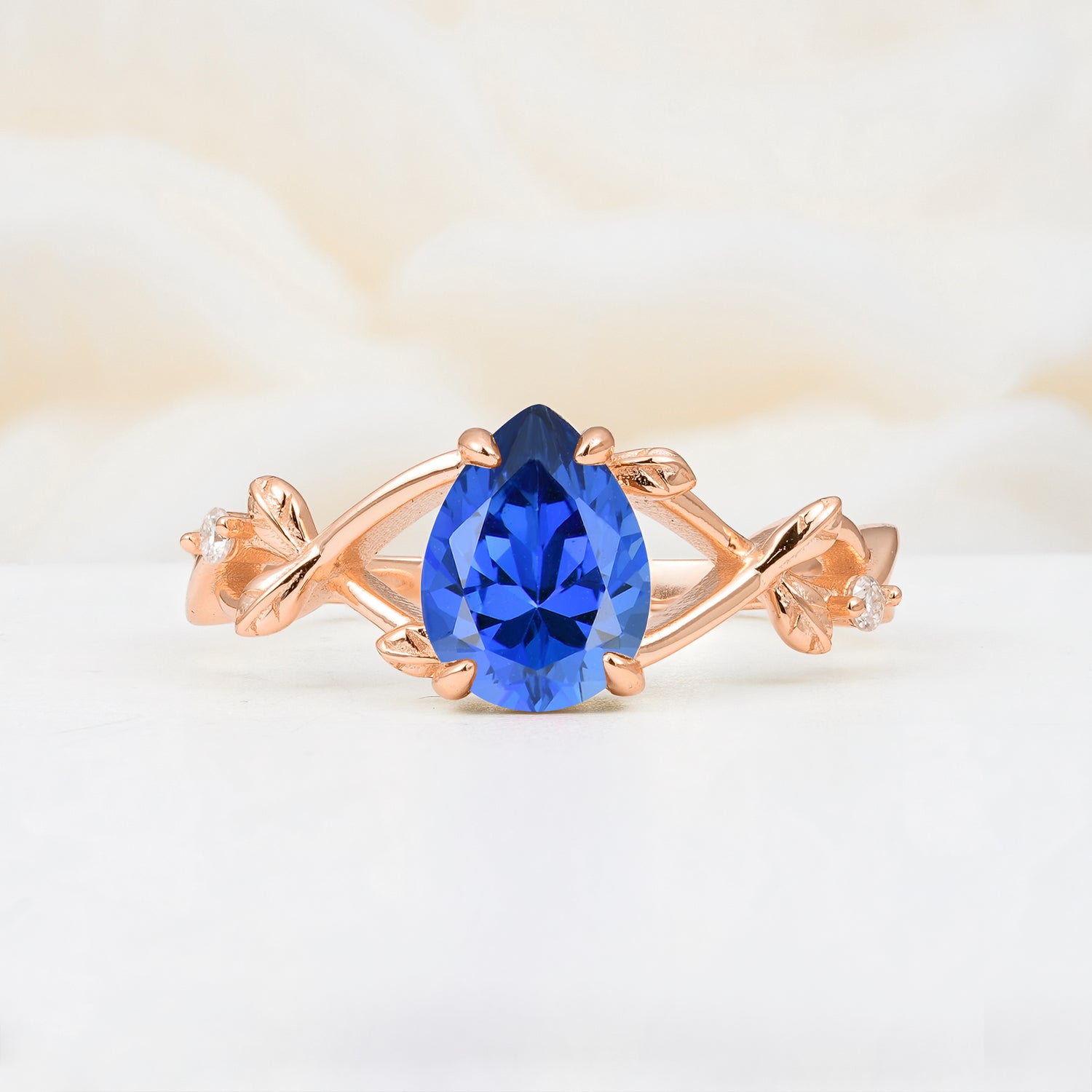 Nature Inspired Four Prong Pear Sapphire Leaf Engagement Ring