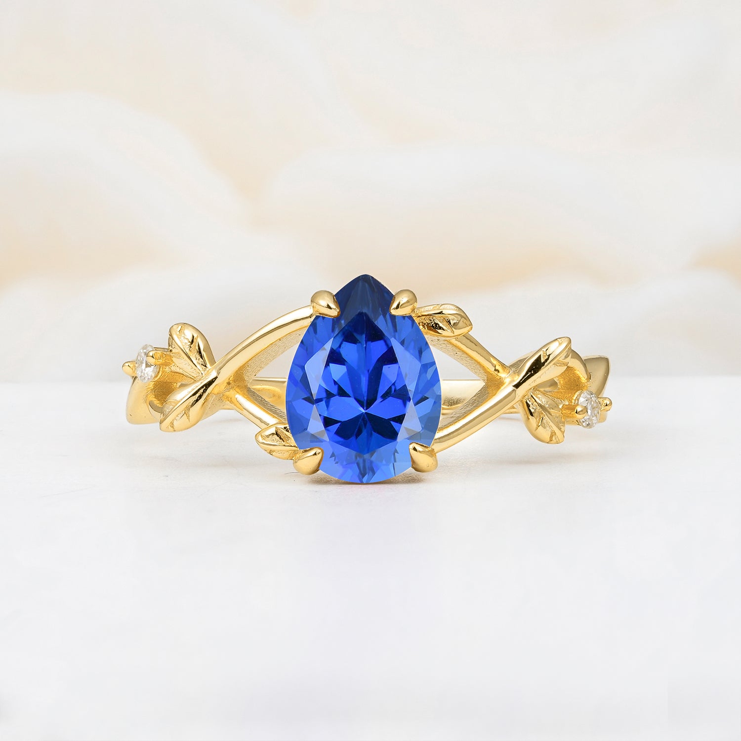 Nature Inspired Four Prong Pear Sapphire Leaf Engagement Ring