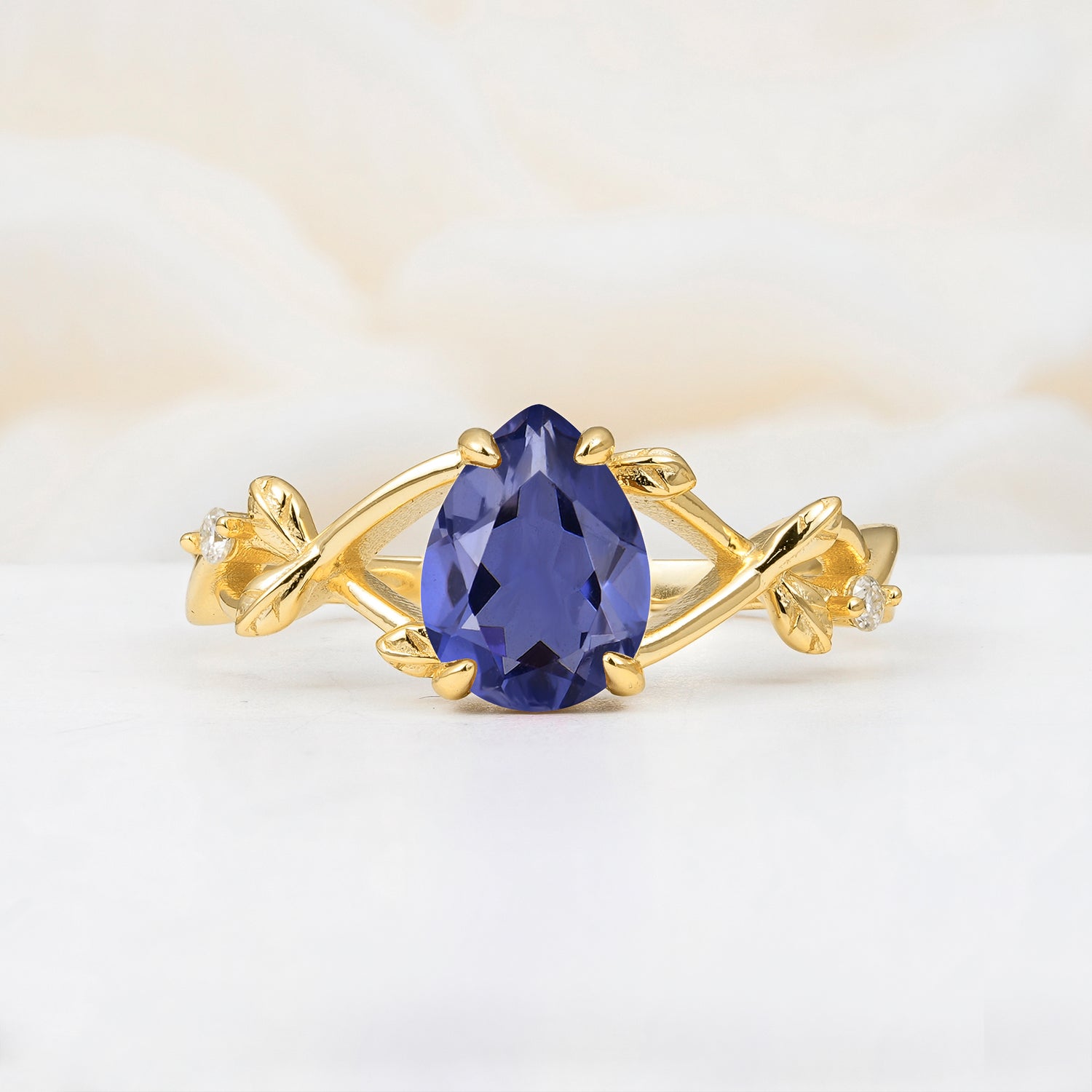 Nature Inspired Four Prong Pear Tanzanite Leaf Engagement Ring
