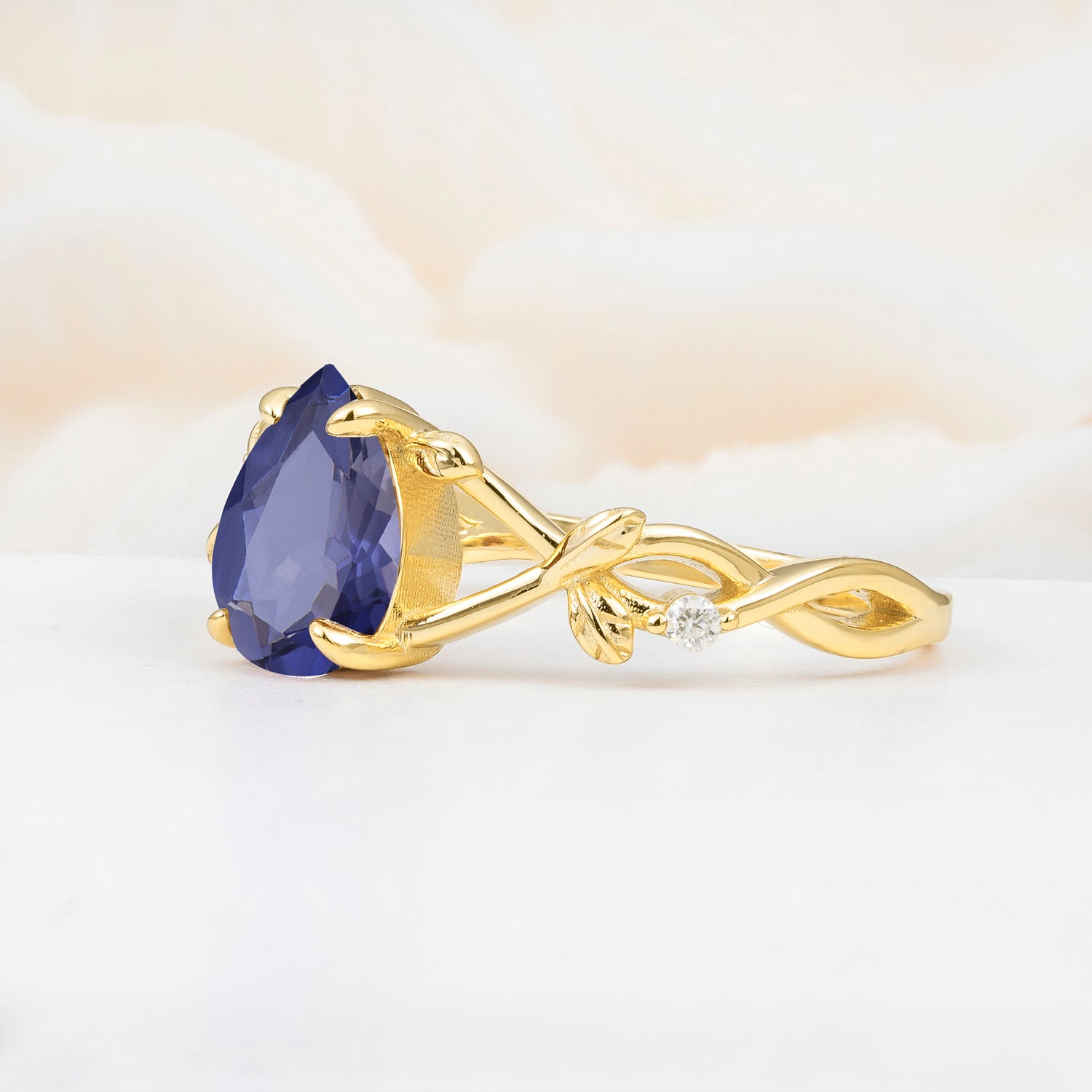 Nature Inspired Four Prong Pear Tanzanite Leaf Engagement Ring