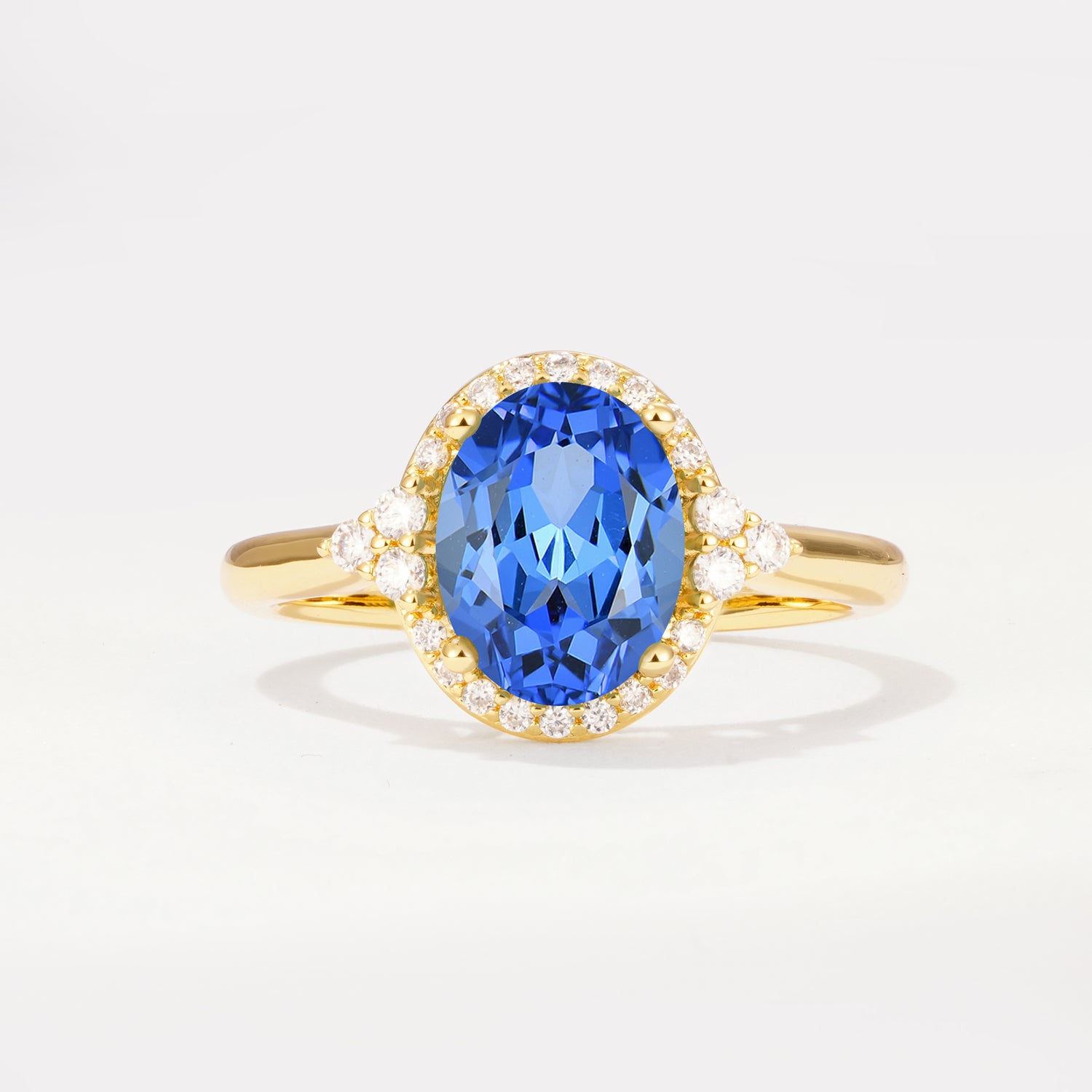 Halo Trillion Accent Oval Cut Sapphire Engagement Ring