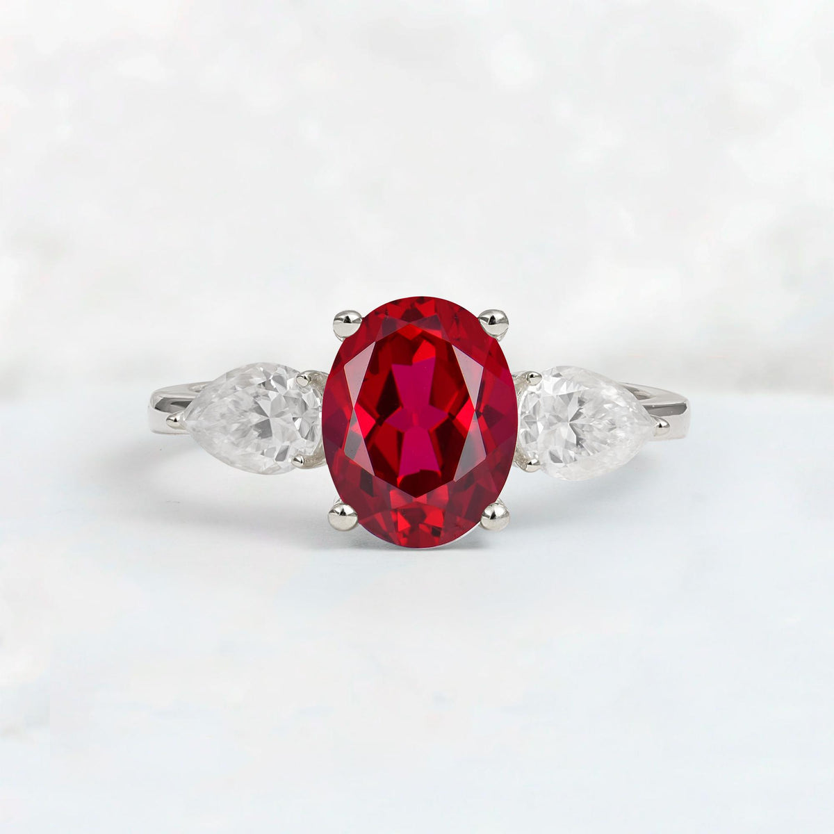Oval Cut Ruby Three-Stone Engagement Ring with Pear Side Stones - Additional view