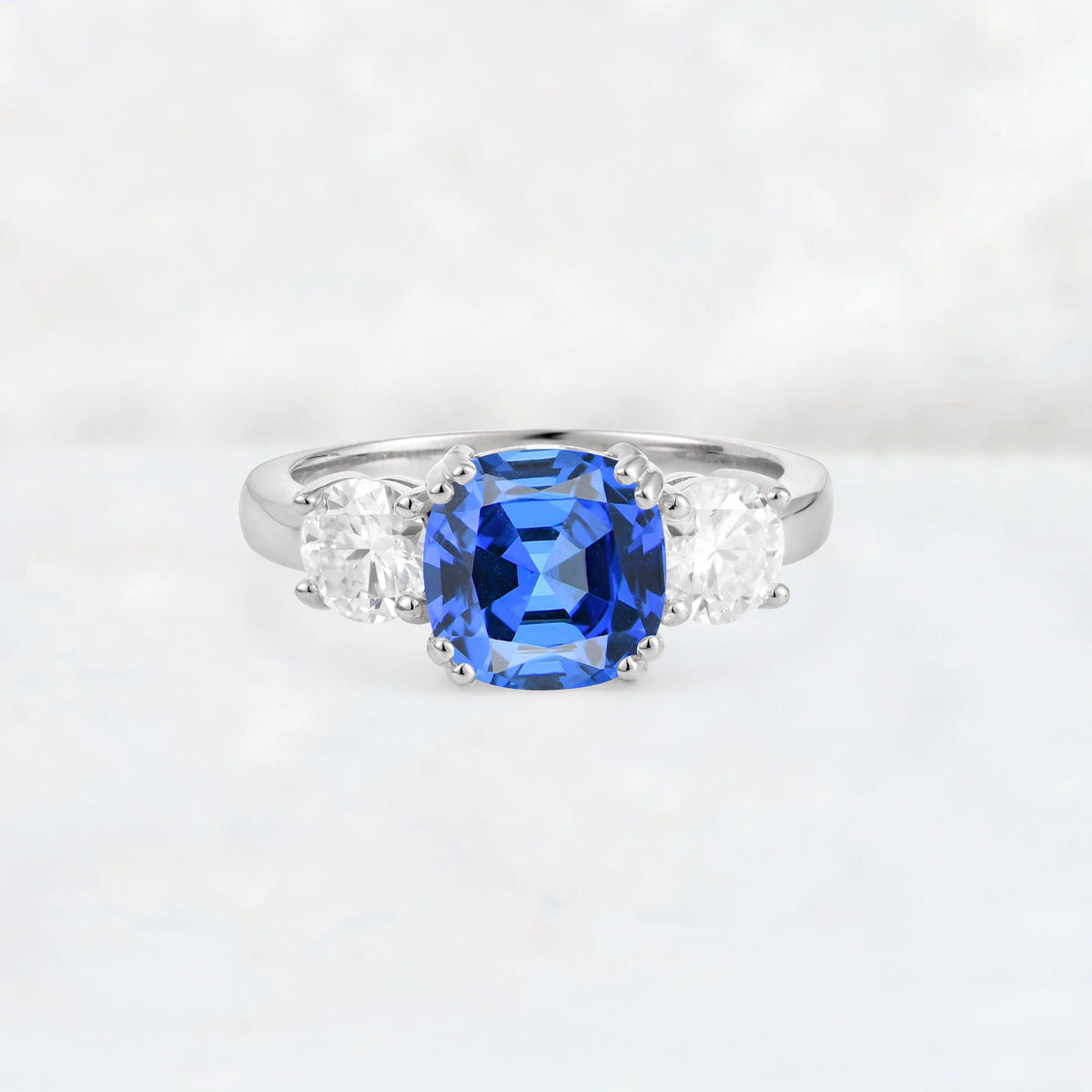 Cushion Sapphire Round Side Stone Three-Stone Engagement Ring - Additional view