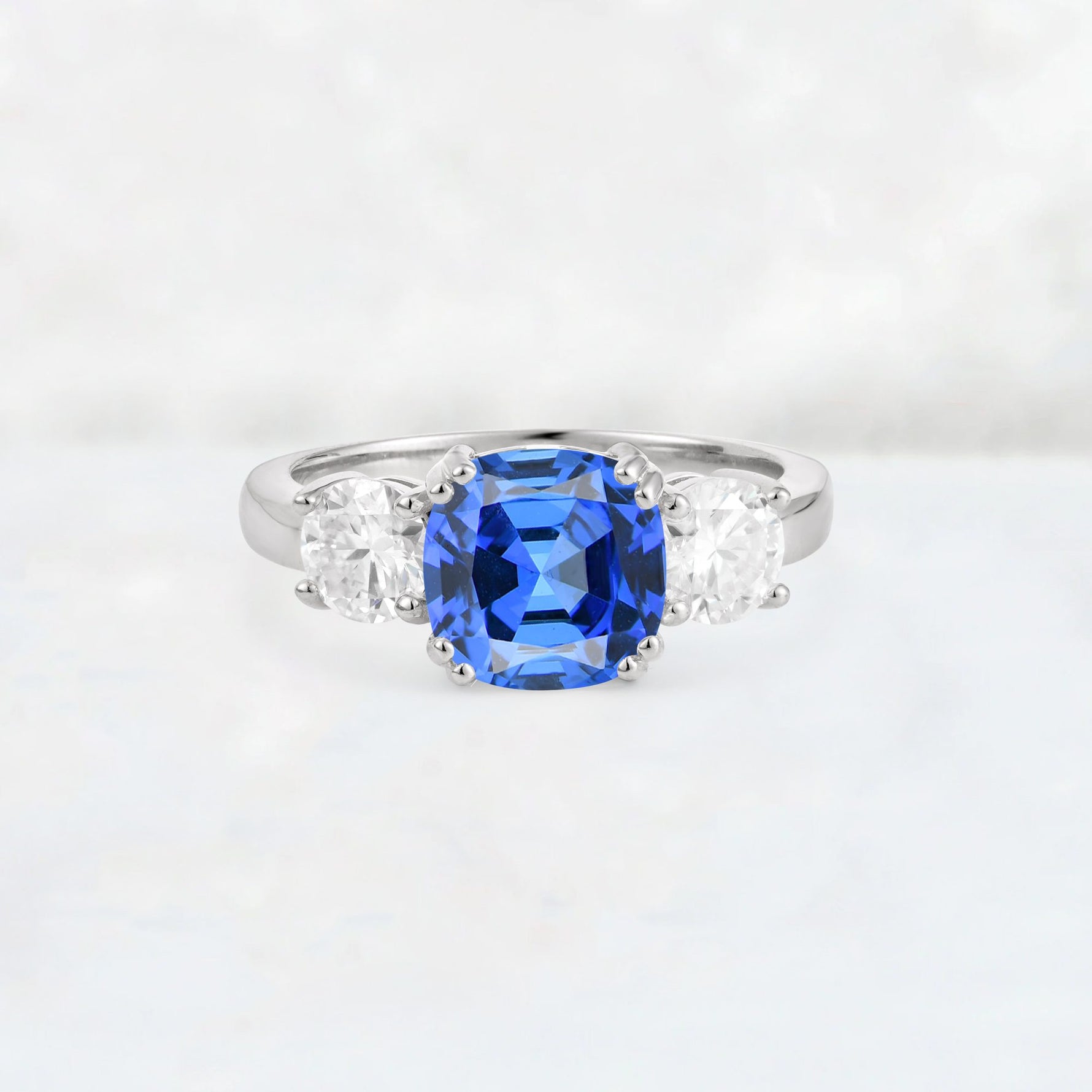 Cushion Sapphire Round Side Stone Three-Stone Engagement Ring - Additional view