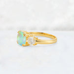 Cushion Fire Opal Round Side Stone Three-Stone Engagement Ring - Additional view