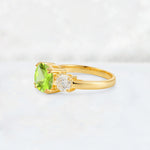 Cushion Peridot Round Side Stone Three-Stone Engagement Ring - Additional view