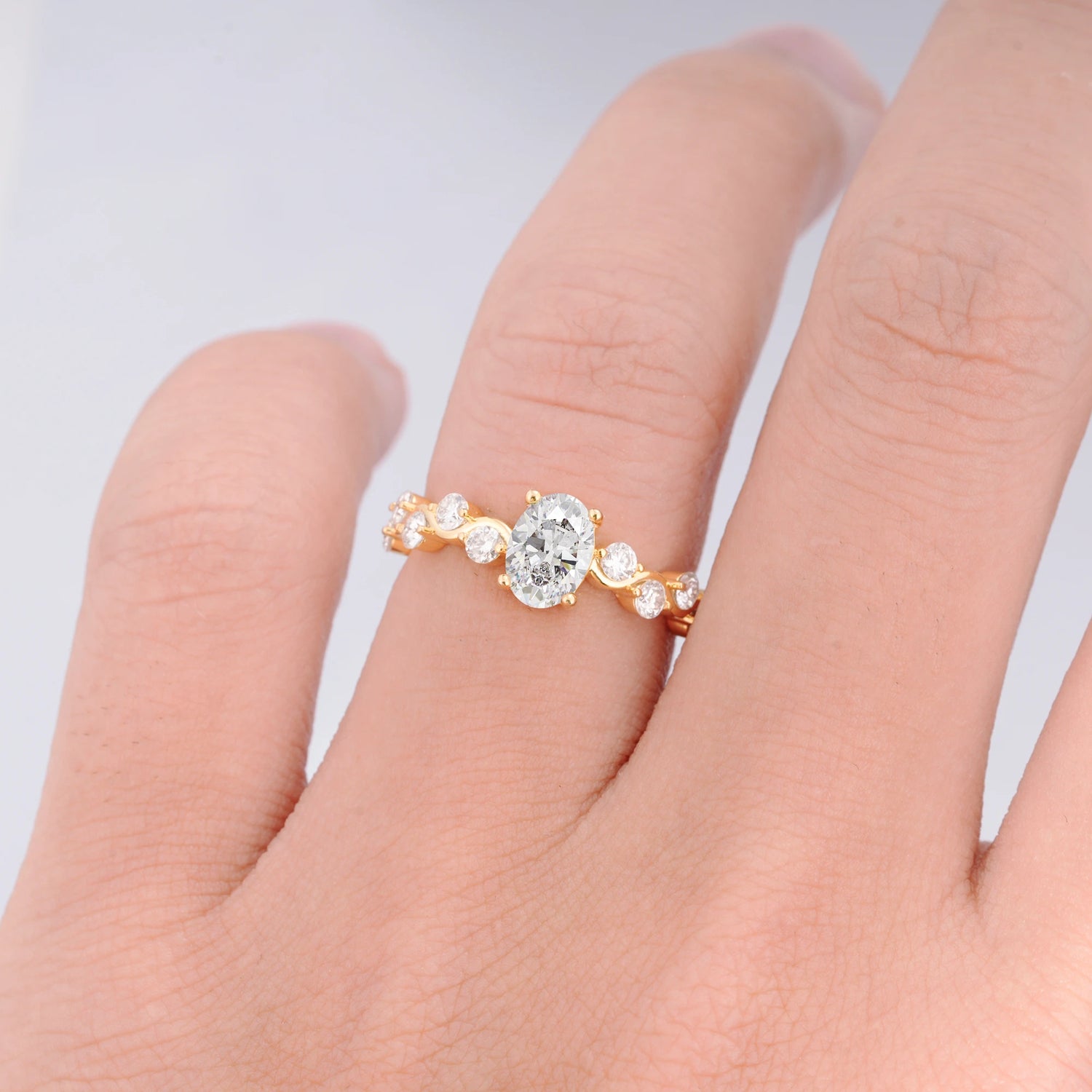 Unique Oval Moissanite Ring with Pave Set Stones