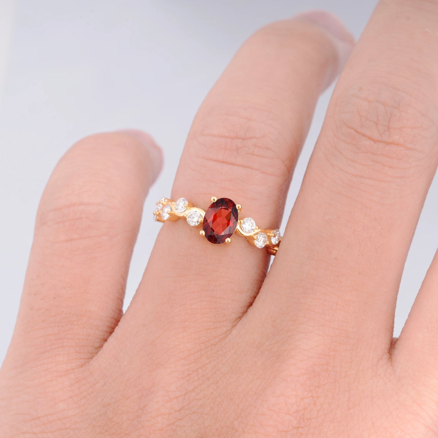 Unique Oval Garnet Ring with Pave Set Stones