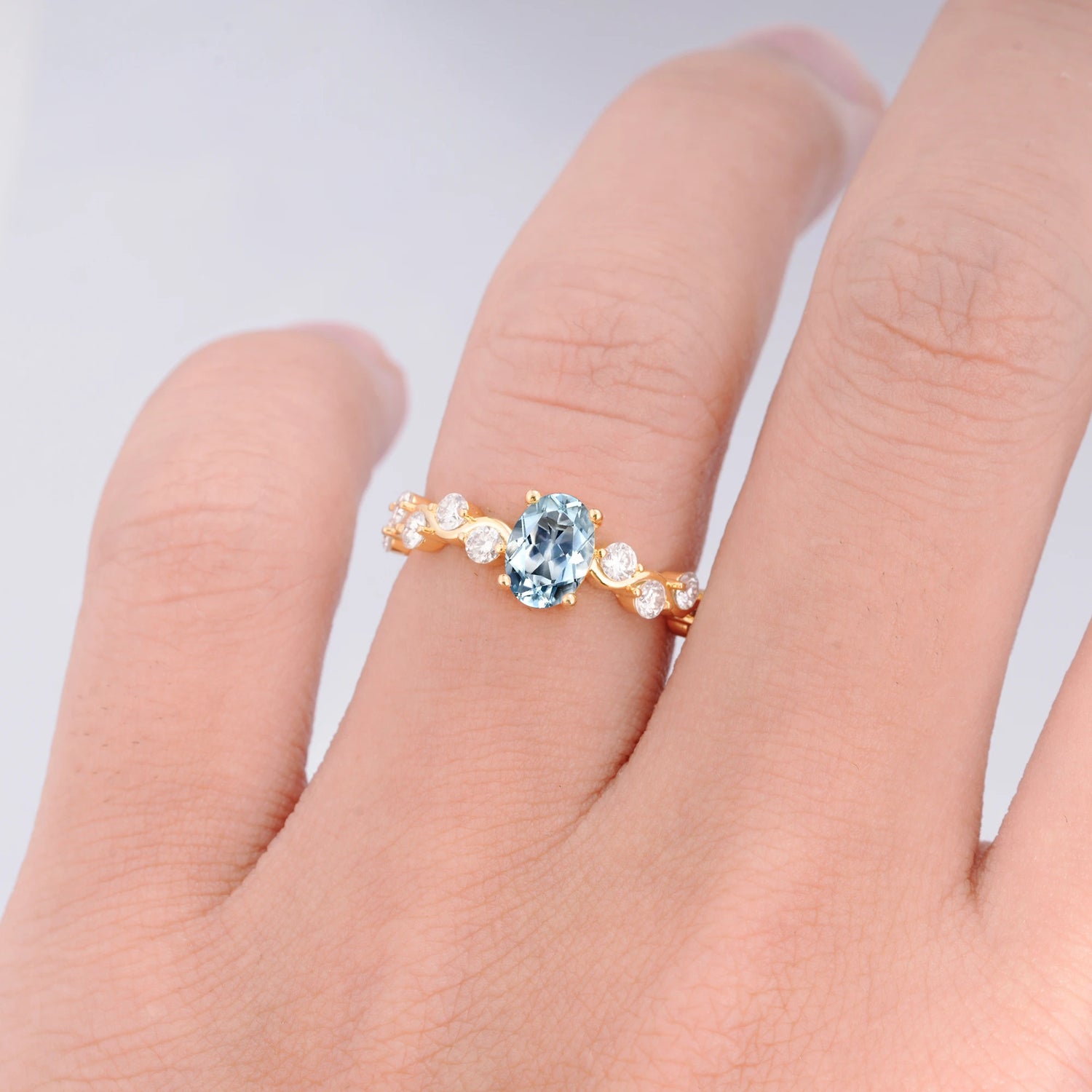 Unique Oval Aquamarine Ring with Pave Set Stones