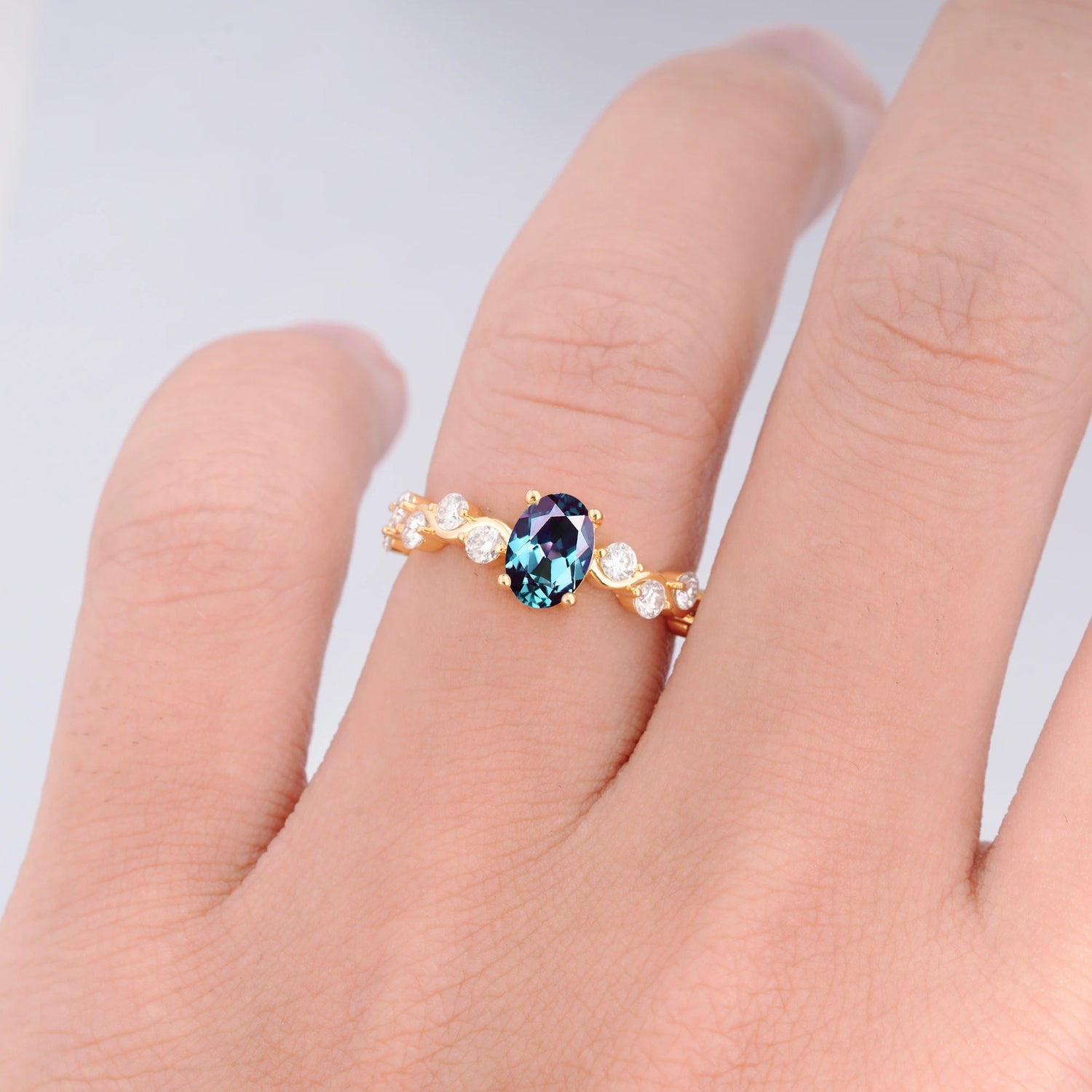Unique Oval Alexandrite Ring with Pave Set Stones
