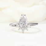 Pear Cut Moissanite Crown Engagement Ring with Accent Stones - Additional view