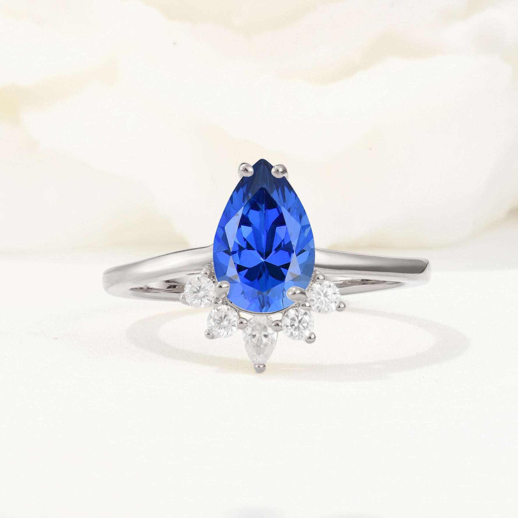 Pear Cut Sapphire Crown Engagement Ring with Accent Stones - Additional view