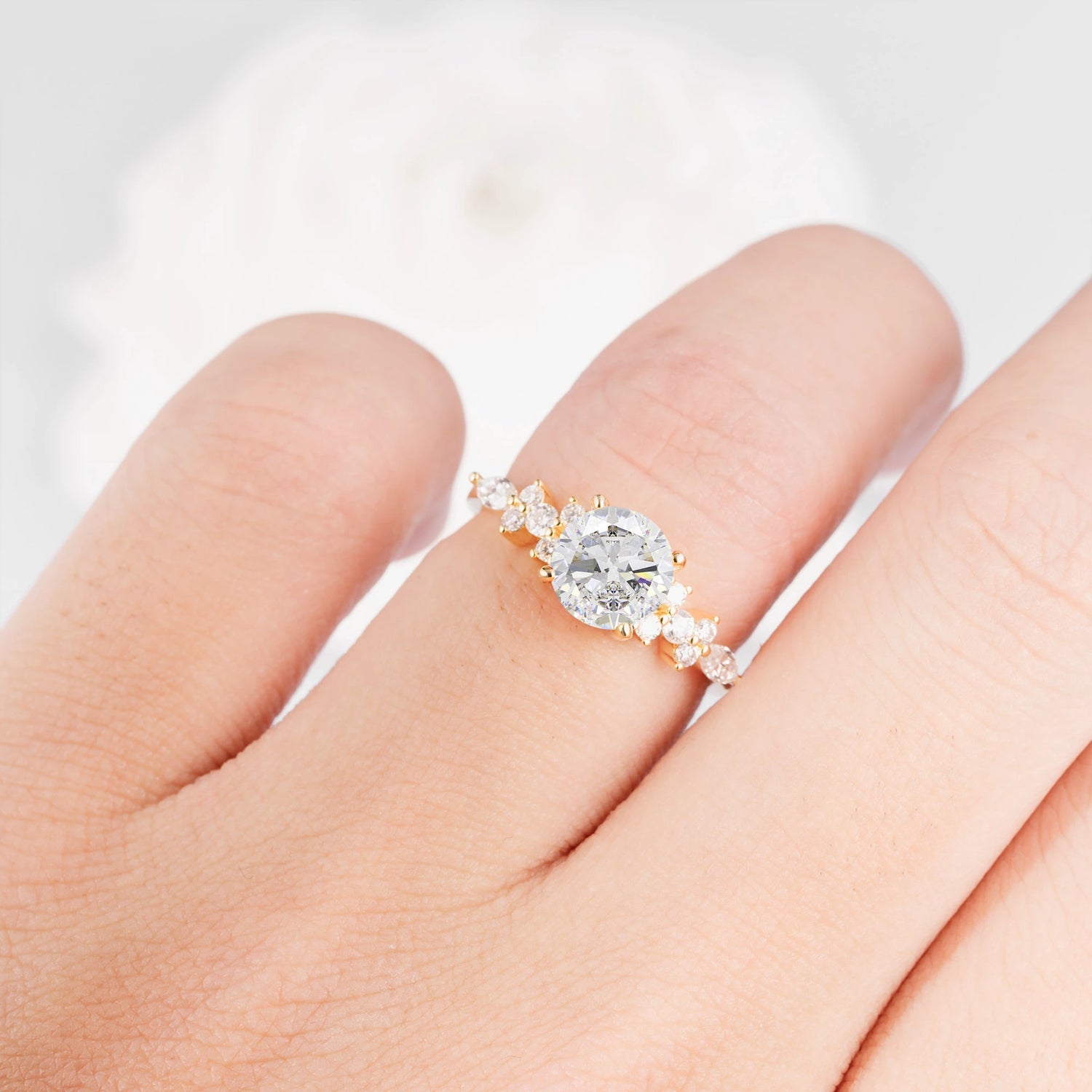Round Cut Moissanite Engagement Ring with Floral Side Stone Design