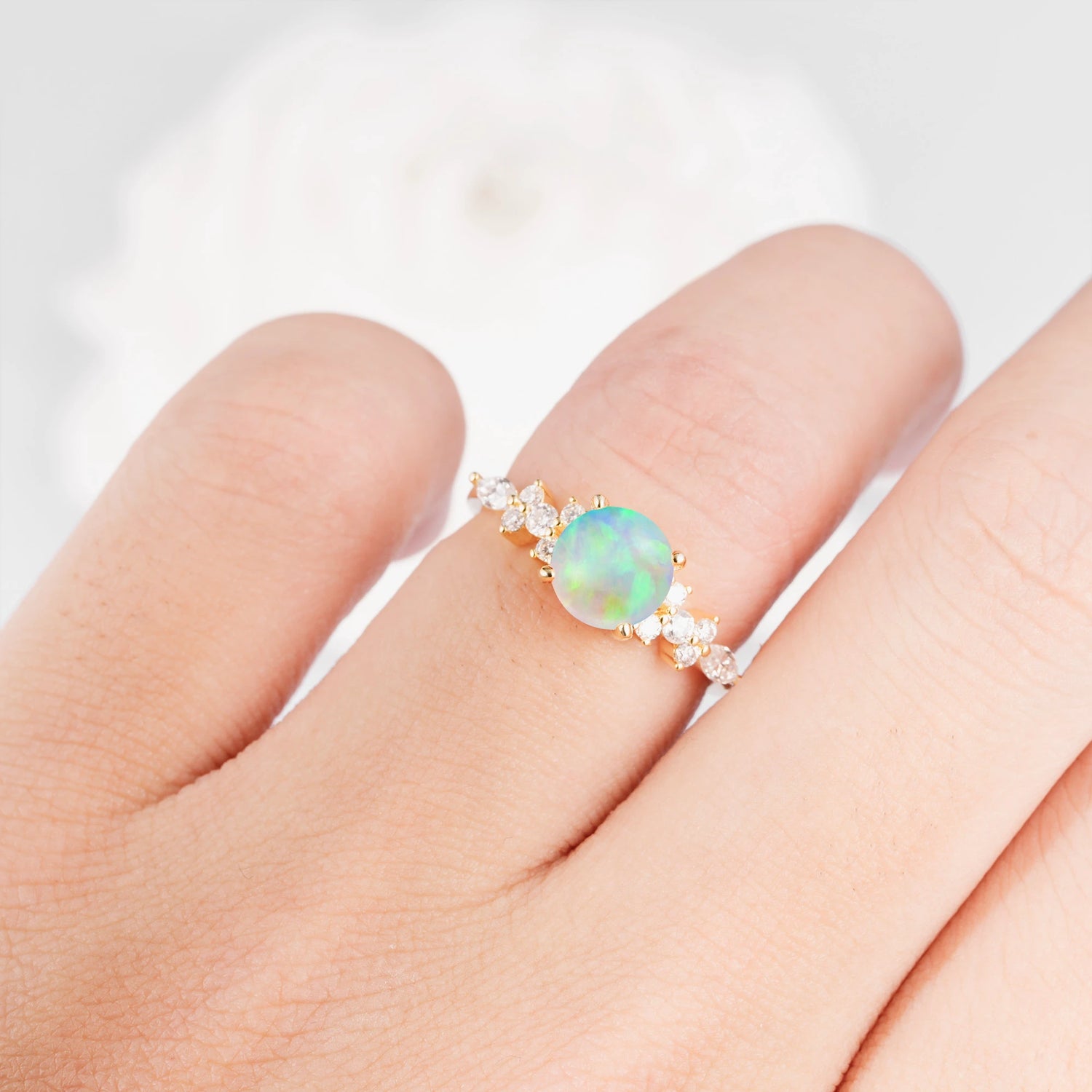 Round Cut Opal Engagement Ring with Floral Side Stone Design