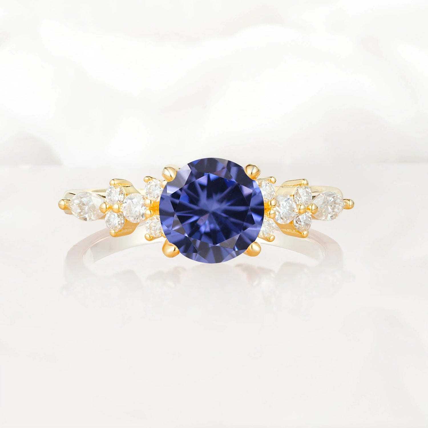 Round Cut Tanzanite Engagement Ring with Floral Side Stone Design
