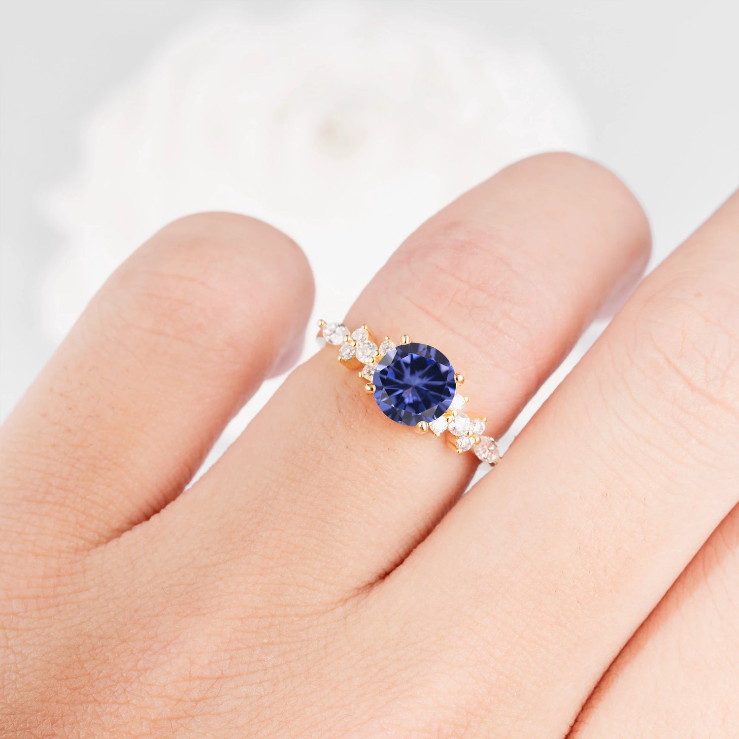 Round Cut Tanzanite Engagement Ring with Floral Side Stone Design