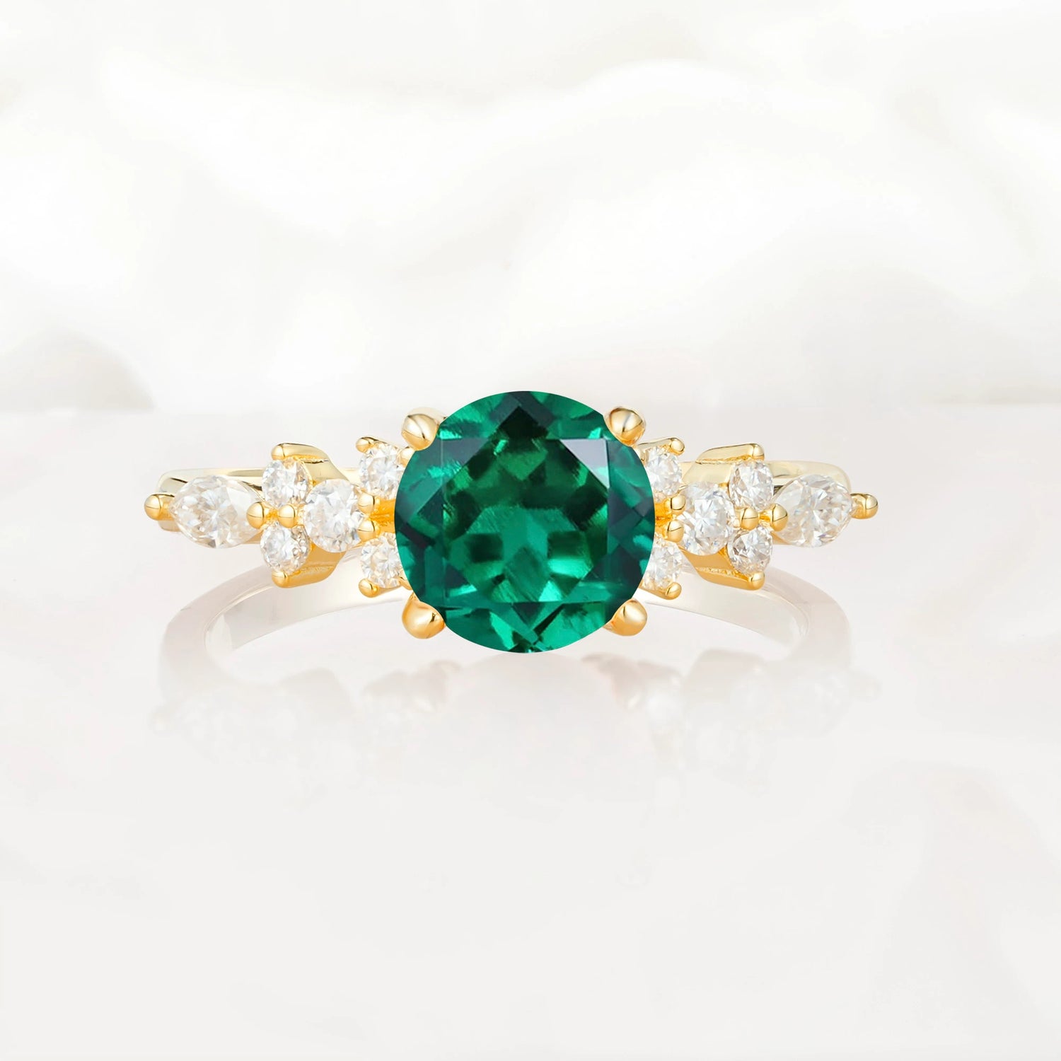 Round Cut Emerald Engagement Ring with Floral Side Stone Design