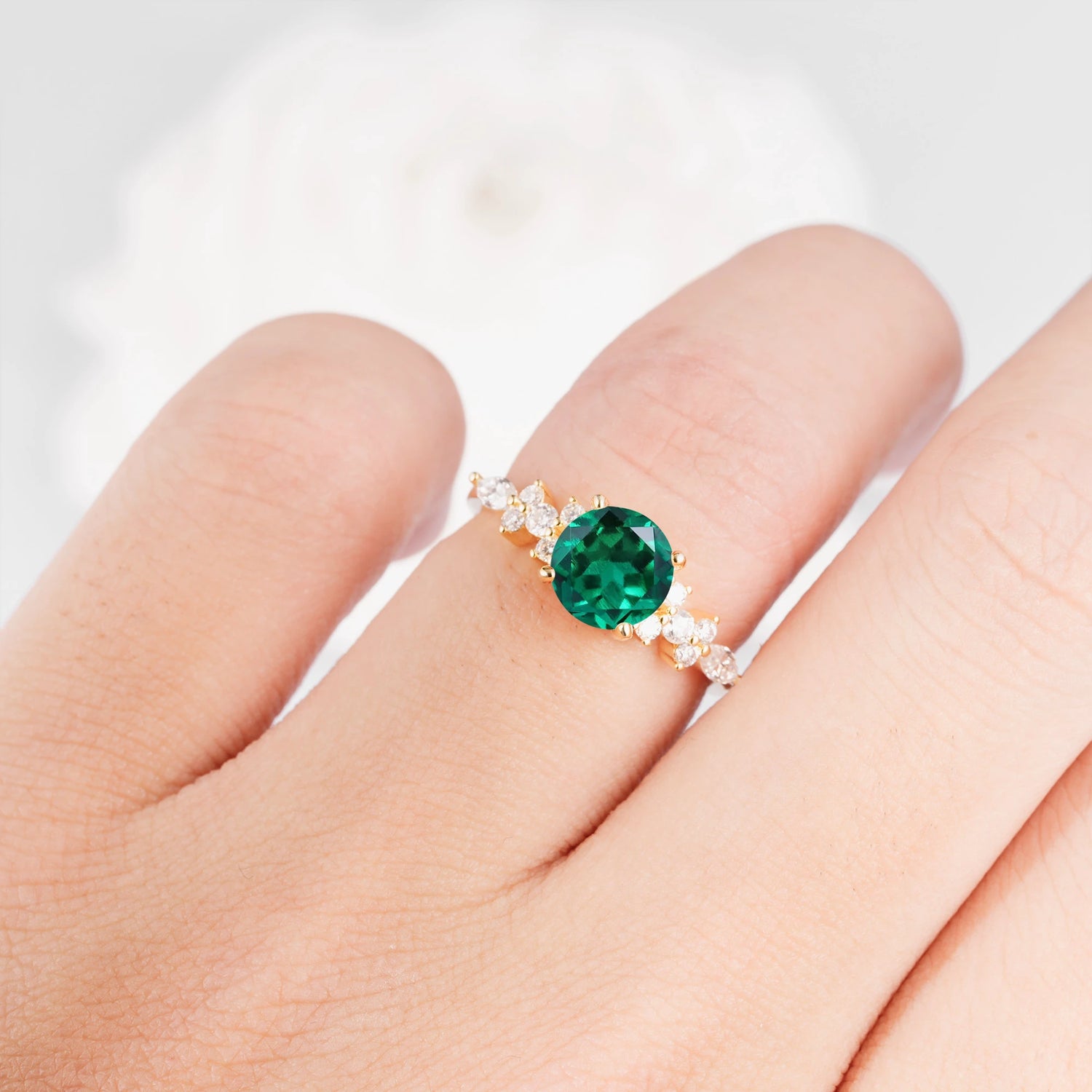 Round Cut Emerald Engagement Ring with Floral Side Stone Design