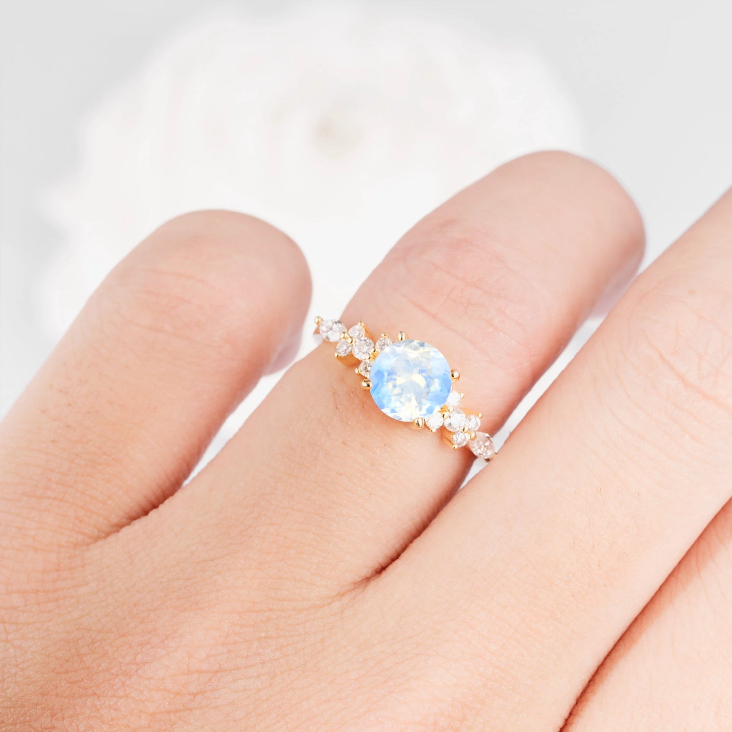 Round Cut Moonstone Engagement Ring with Floral Side Stone Design