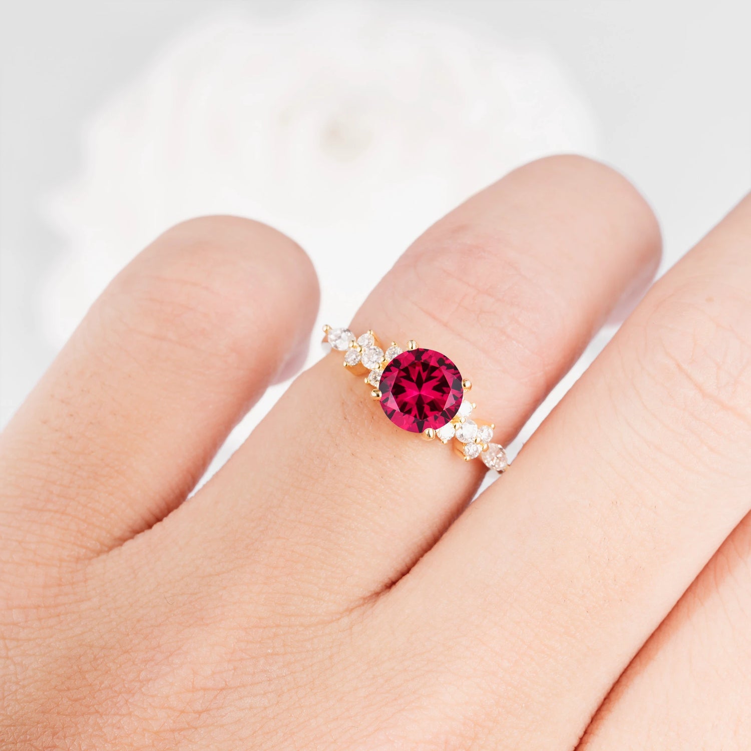 Round Cut Ruby Engagement Ring with Floral Side Stone Design
