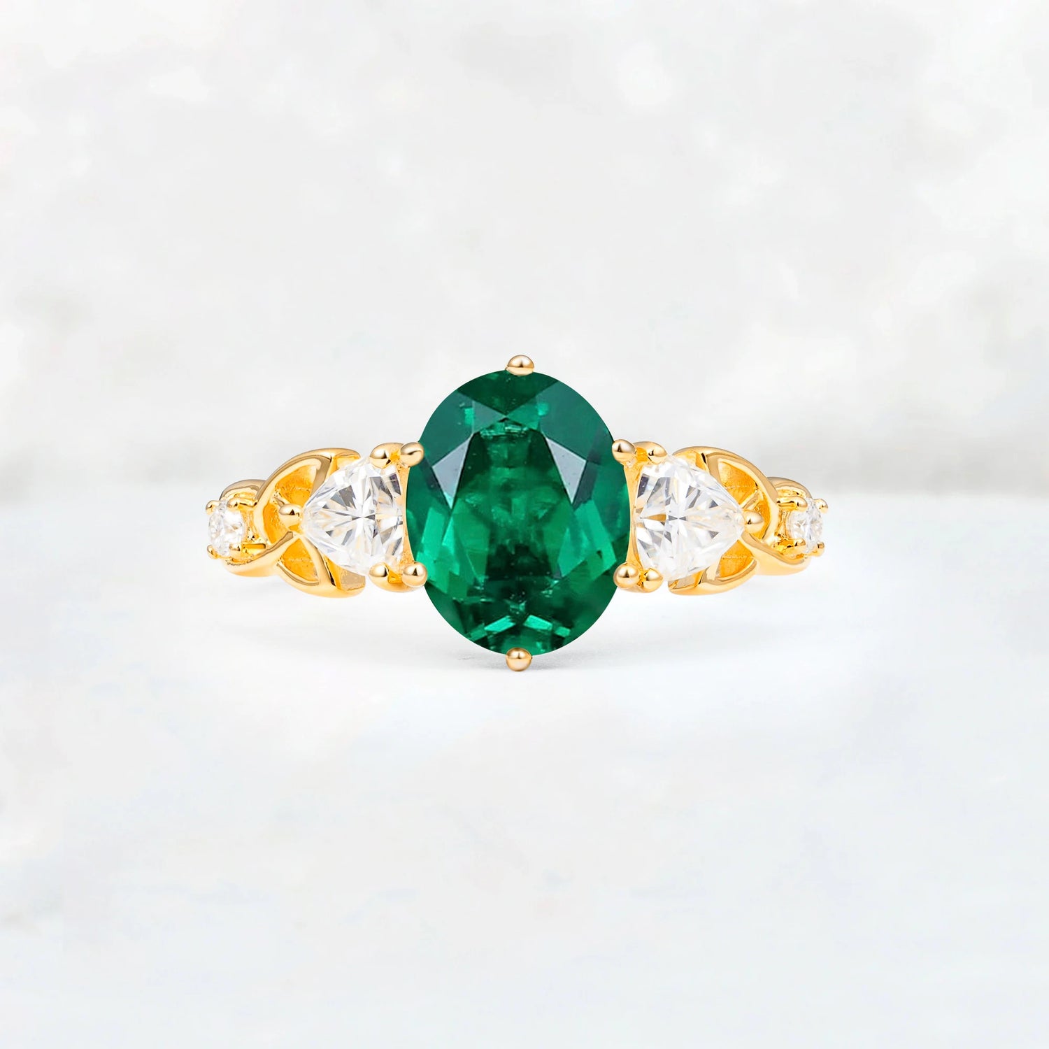 Elegant Oval Cut Trillion Side Accent Emerald Engagement Ring