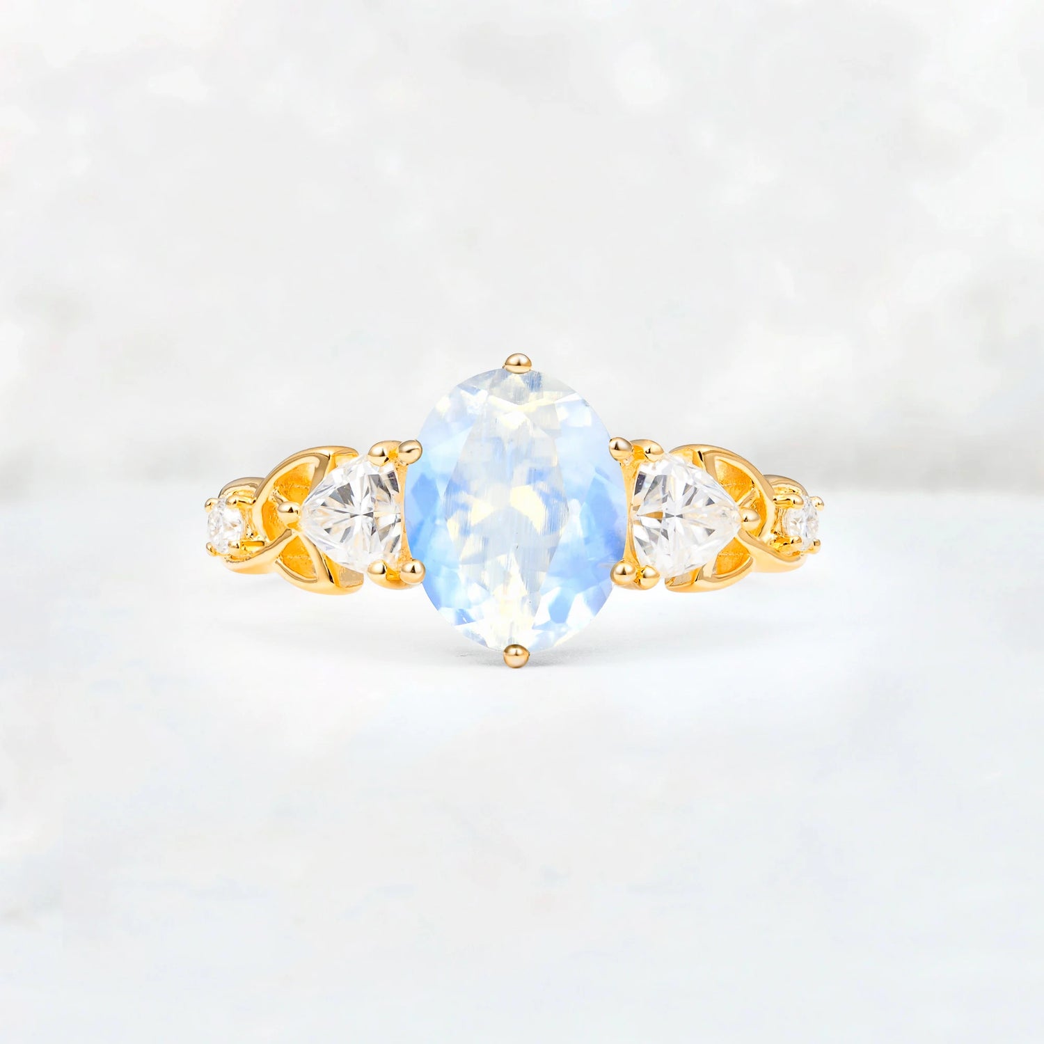 Elegant Oval Cut Trillion Side Accent Moonstone Engagement Ring