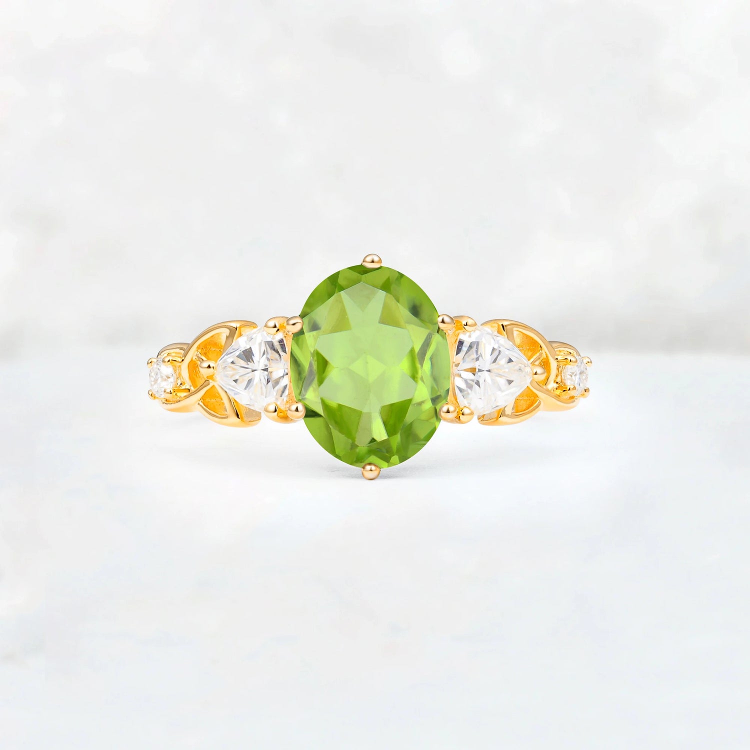 Elegant Oval Cut Trillion Side Accent Peridot Engagement Ring