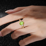 Elegant Oval Cut Trillion Side Accent Peridot Engagement Ring - Additional view
