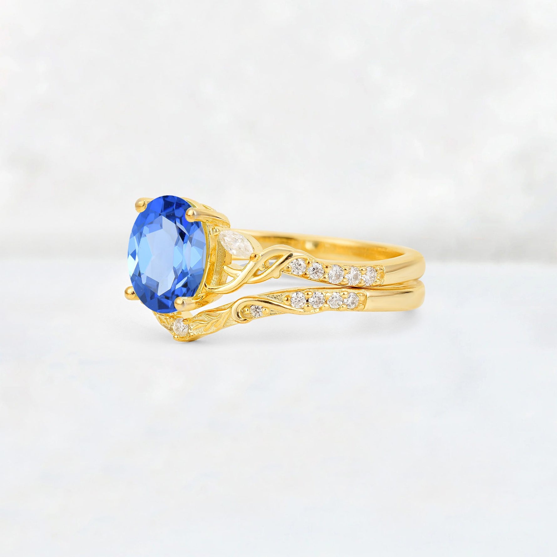 Oval Cut Sapphire Wedding Ring Set with Leaf and Vine Detail - Rose-Gold