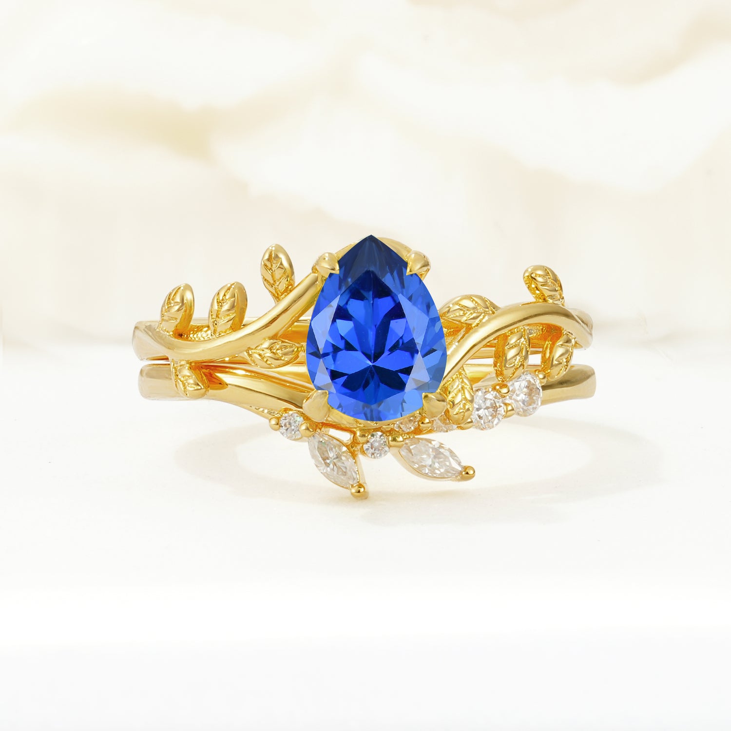 Nature-Inspired Pear Cut Sapphire Bridal Ring Set