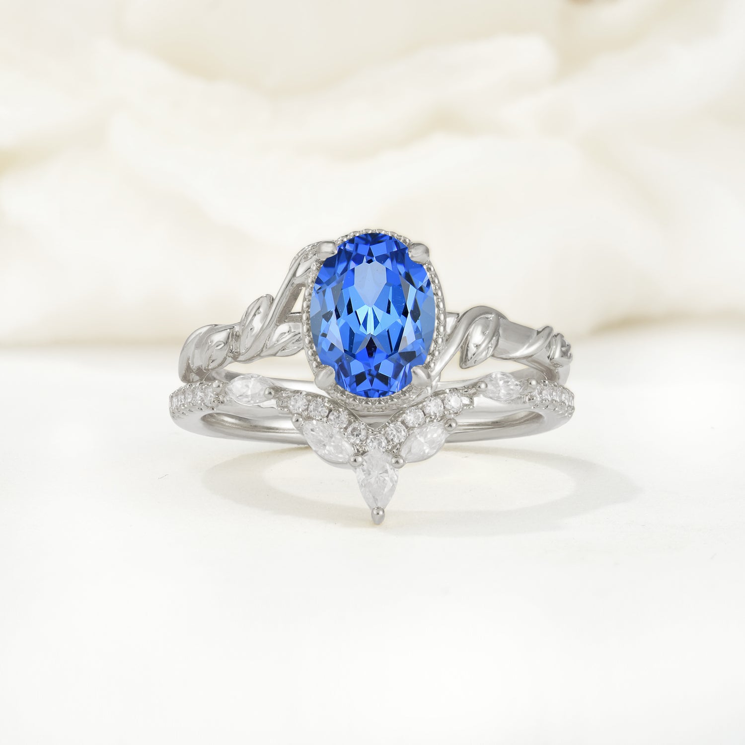 Nature-Inspired Oval-Cut Sapphire Bridal Ring Set