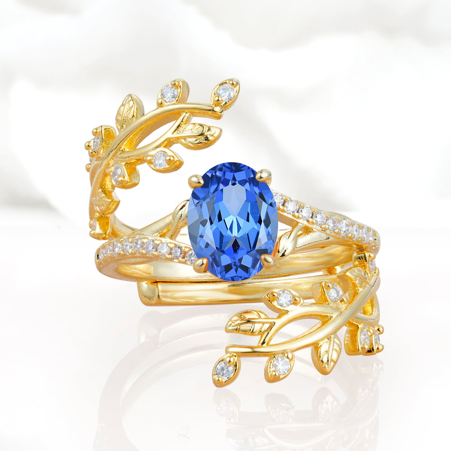 Nature-Inspired Gold Leaf Sapphire Bridal Ring Set with Oval Cut