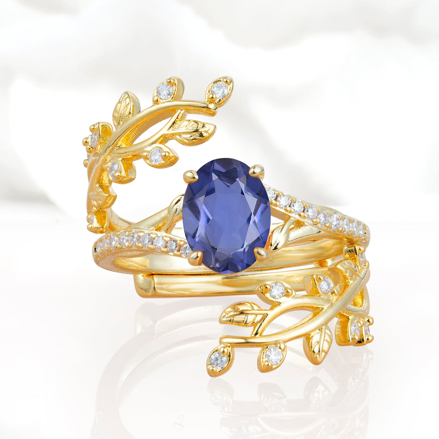 Nature-Inspired Gold Leaf Tanzanite Bridal Ring Set with Oval Cut