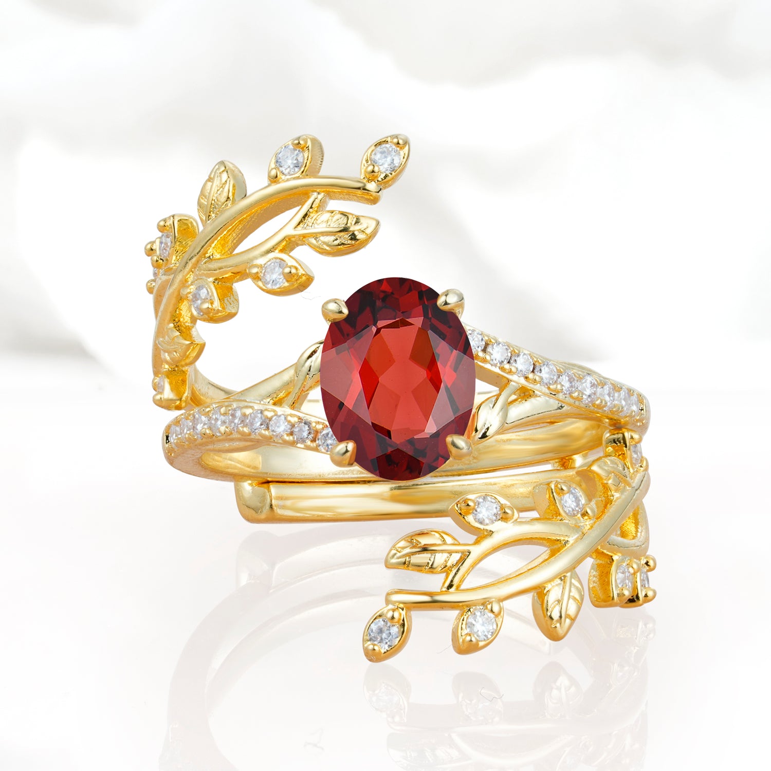 Nature-Inspired Gold Leaf Garnet Bridal Ring Set with Oval Cut