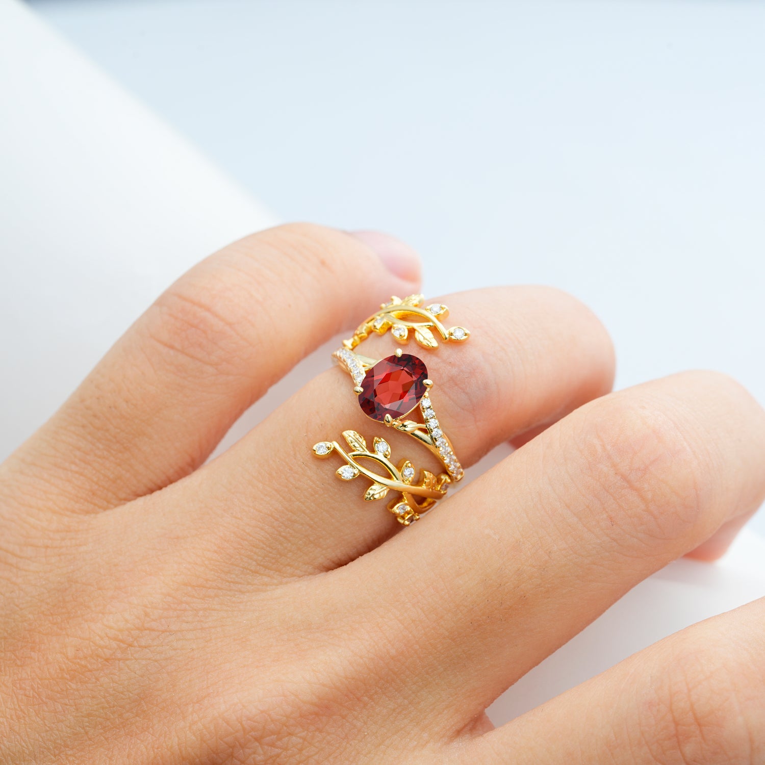 Nature-Inspired Gold Leaf Garnet Bridal Ring Set with Oval Cut