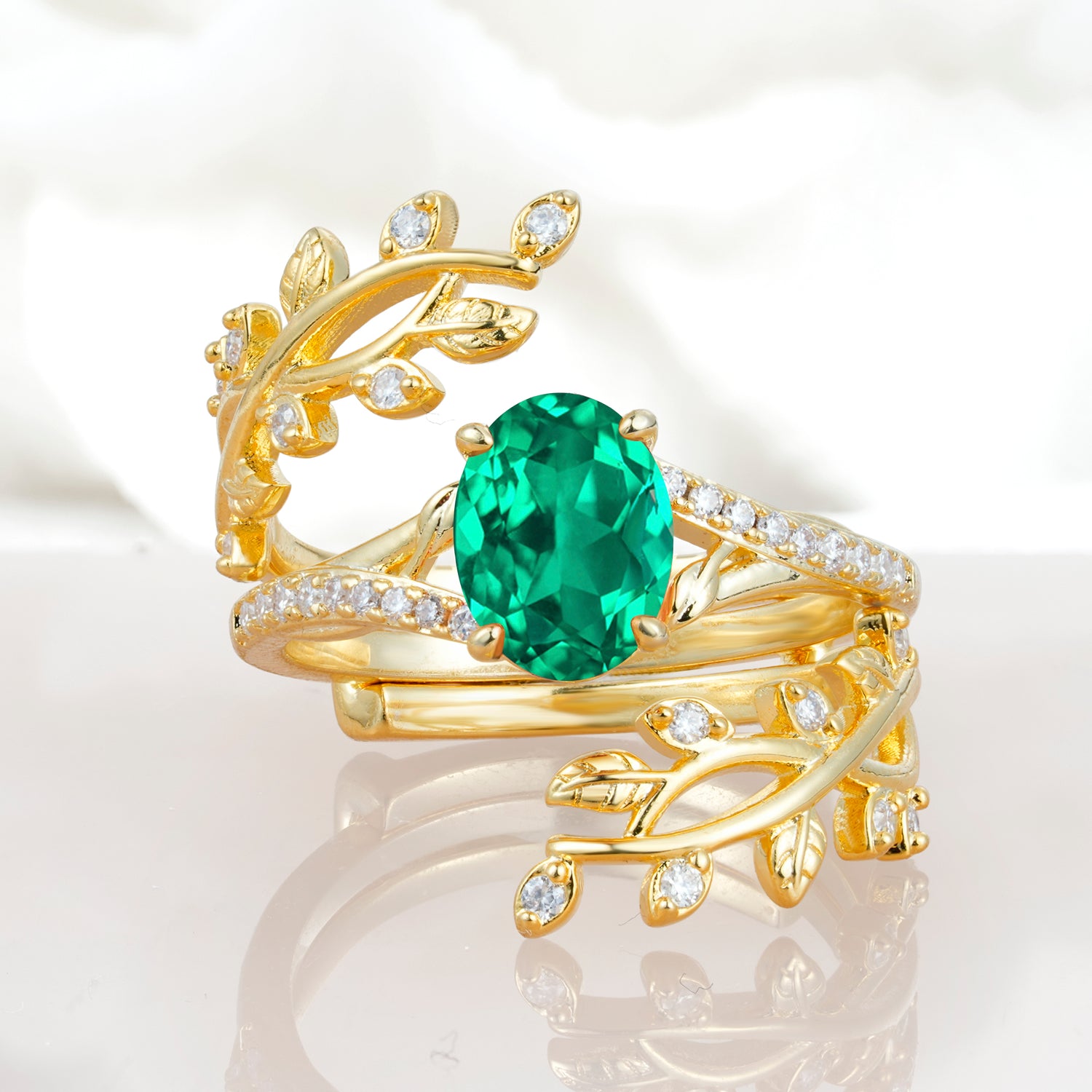 Nature-Inspired Gold Leaf Emerald Bridal Ring Set with Oval Cut