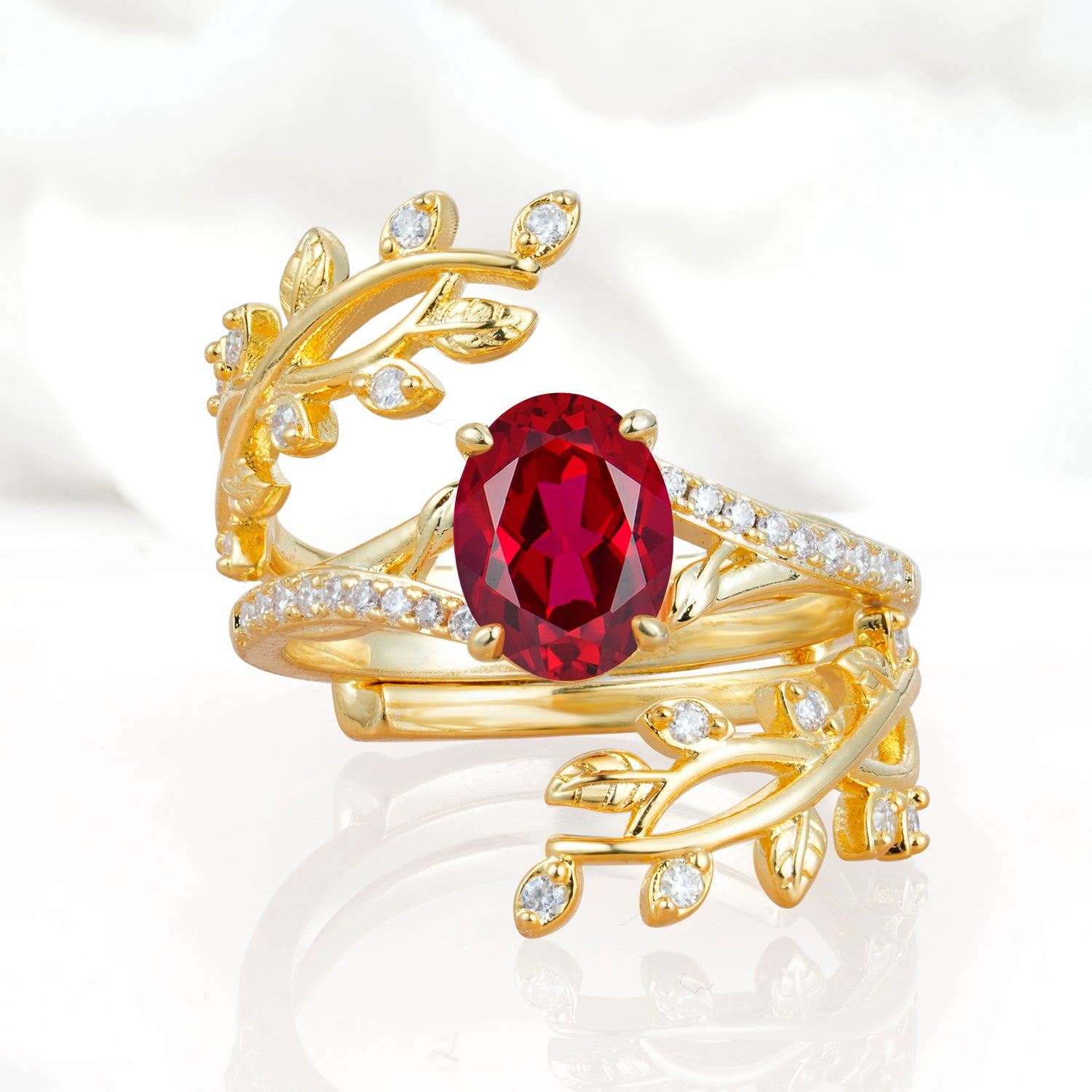 Nature-Inspired Gold Leaf Ruby Bridal Ring Set with Oval Cut