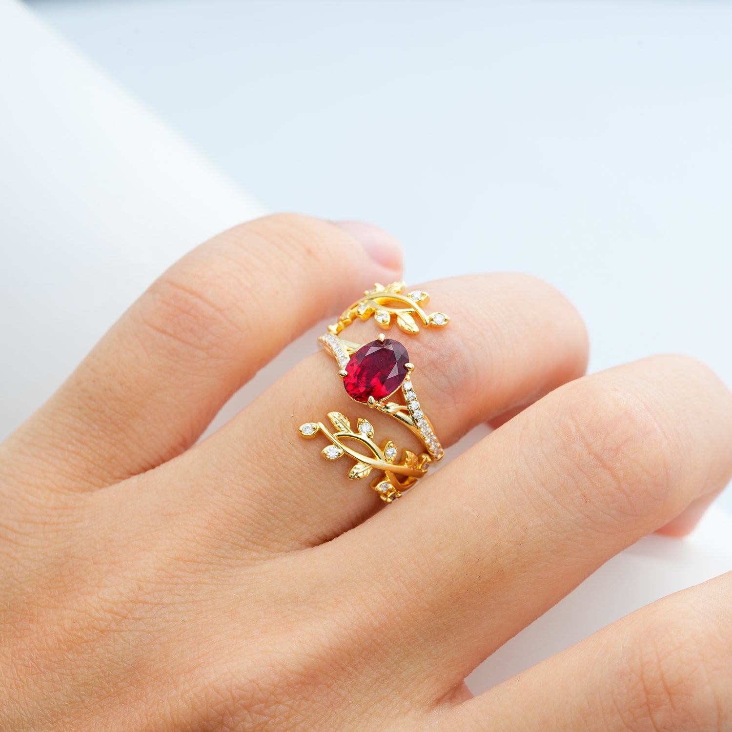 Nature-Inspired Gold Leaf Ruby Bridal Ring Set with Oval Cut