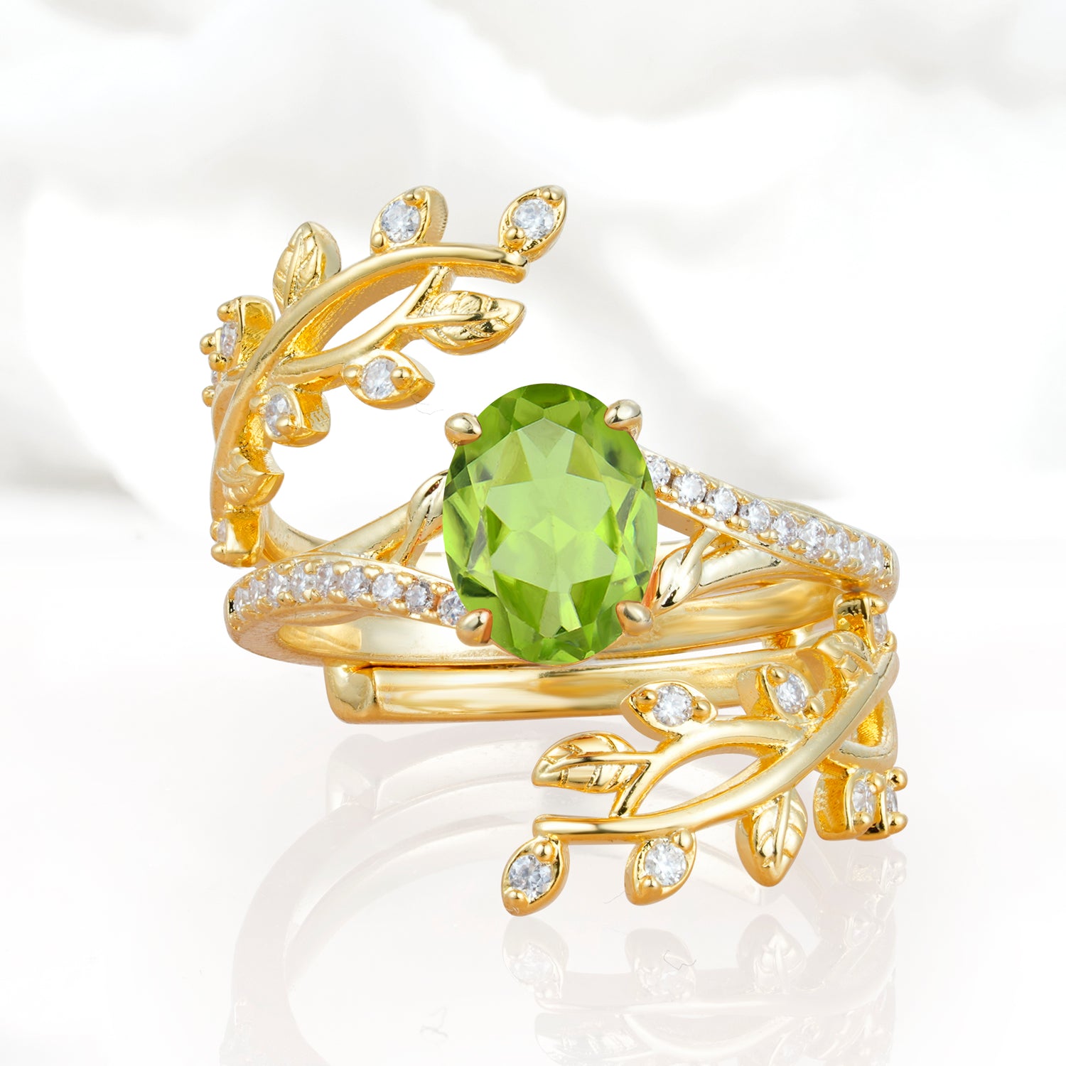 Nature-Inspired Gold Leaf Peridot Bridal Ring Set with Oval Cut