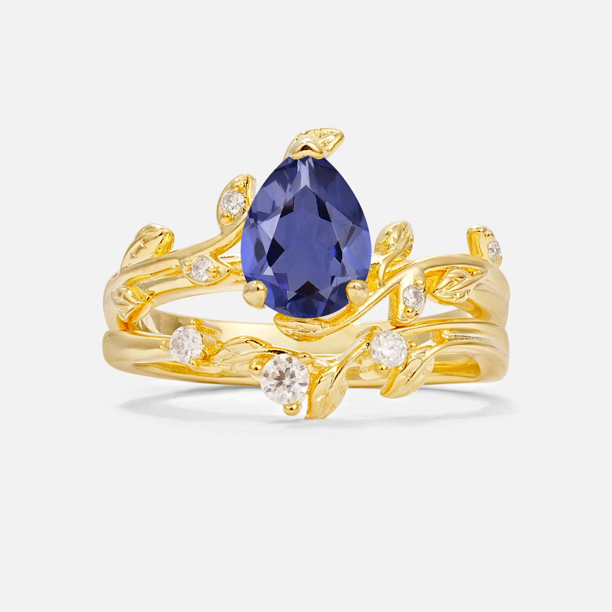 Nature-Inspired Pear Cut Tanzanite Engagement Ring Set with Twisted Vine Accents