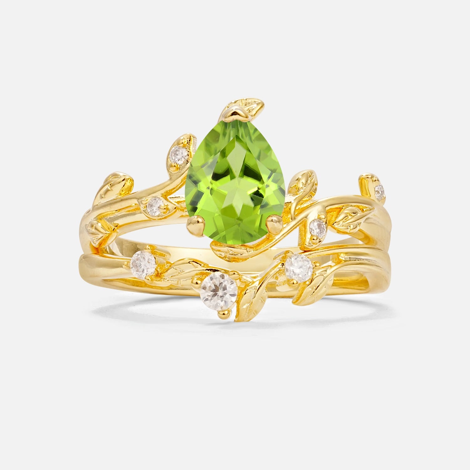 Nature-Inspired Pear Cut Peridot Engagement Ring Set with Twisted Vine Accents