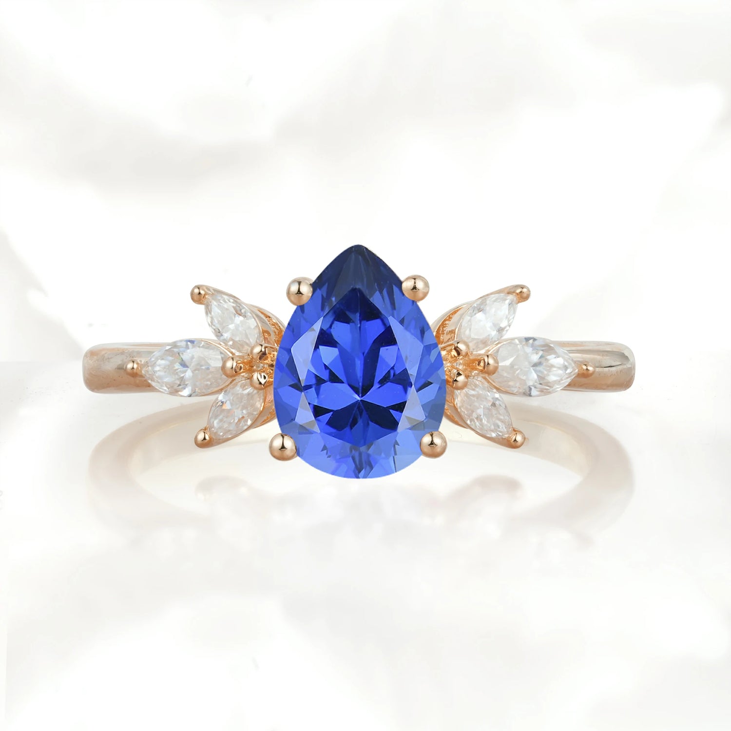 Elegant Pear-Shaped Sapphire Engagement Ring with Floral Side Stones