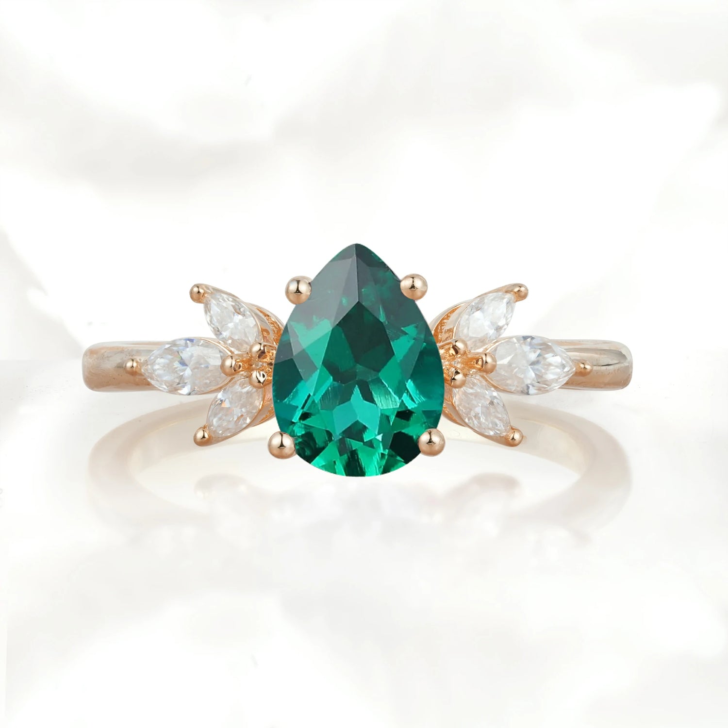 Elegant Pear-Shaped Emerald Engagement Ring with Floral Side Stones