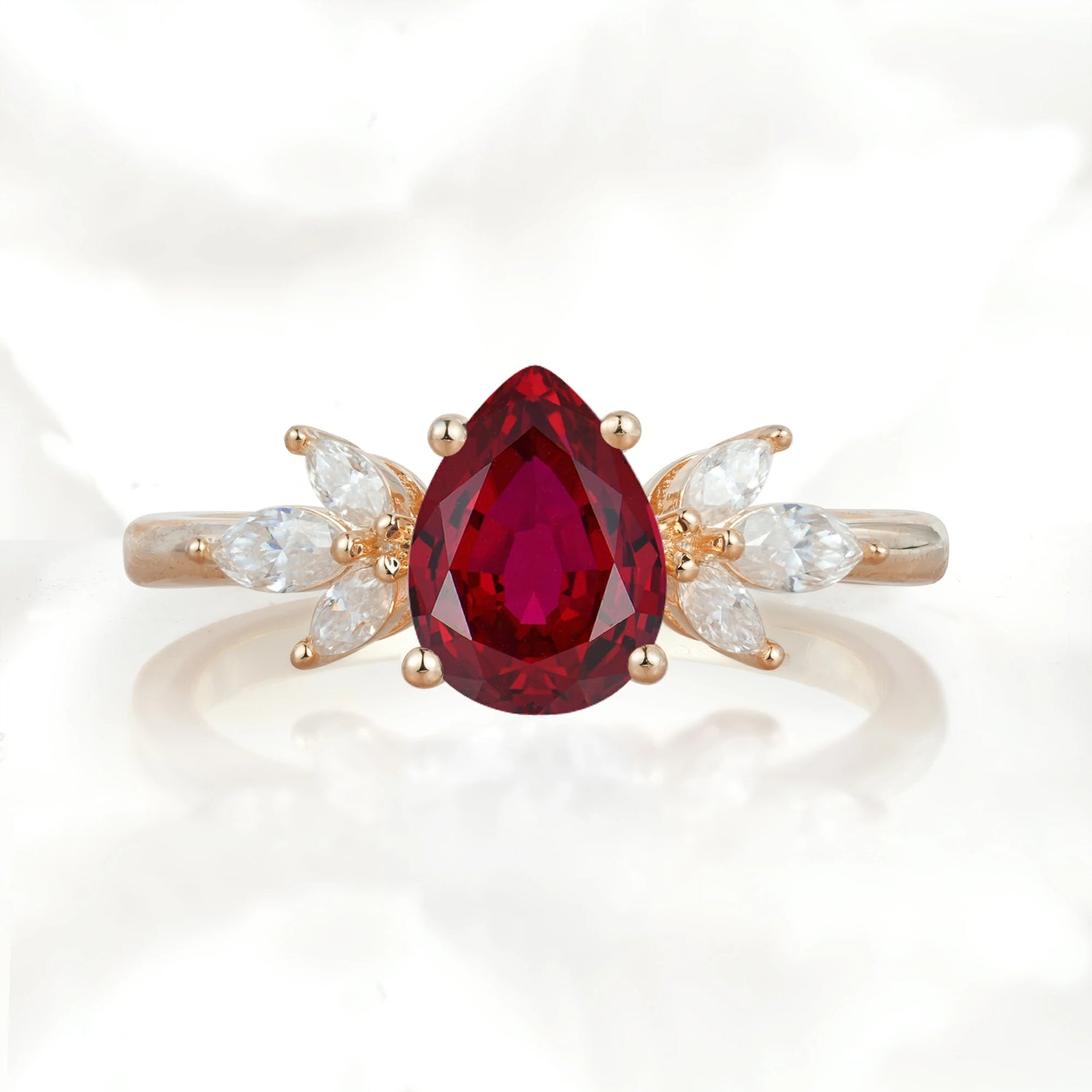 Elegant Pear-Shaped Ruby Engagement Ring with Floral Side Stones
