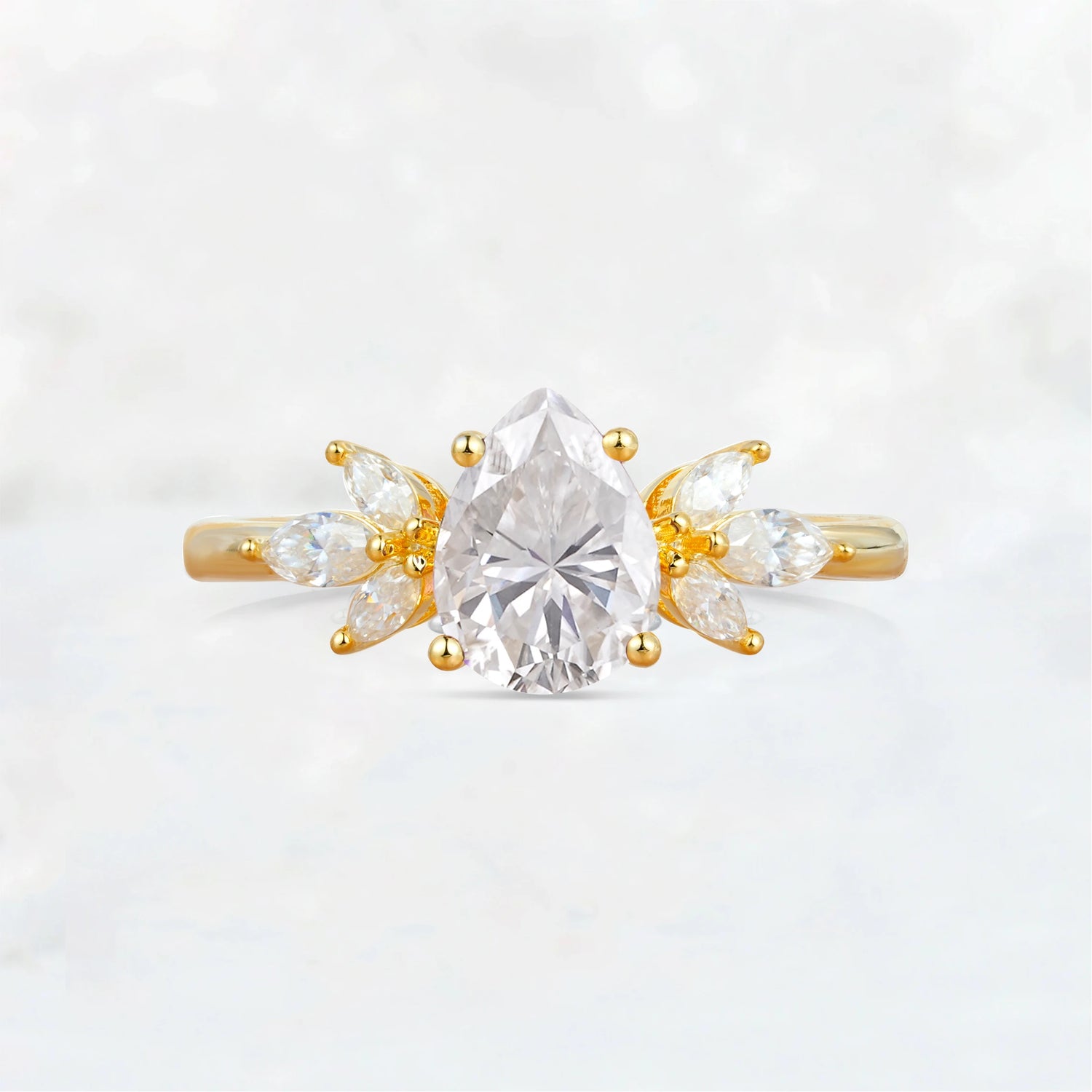 Elegant Pear-Shaped Moissanite Engagement Ring with Floral Side Stones